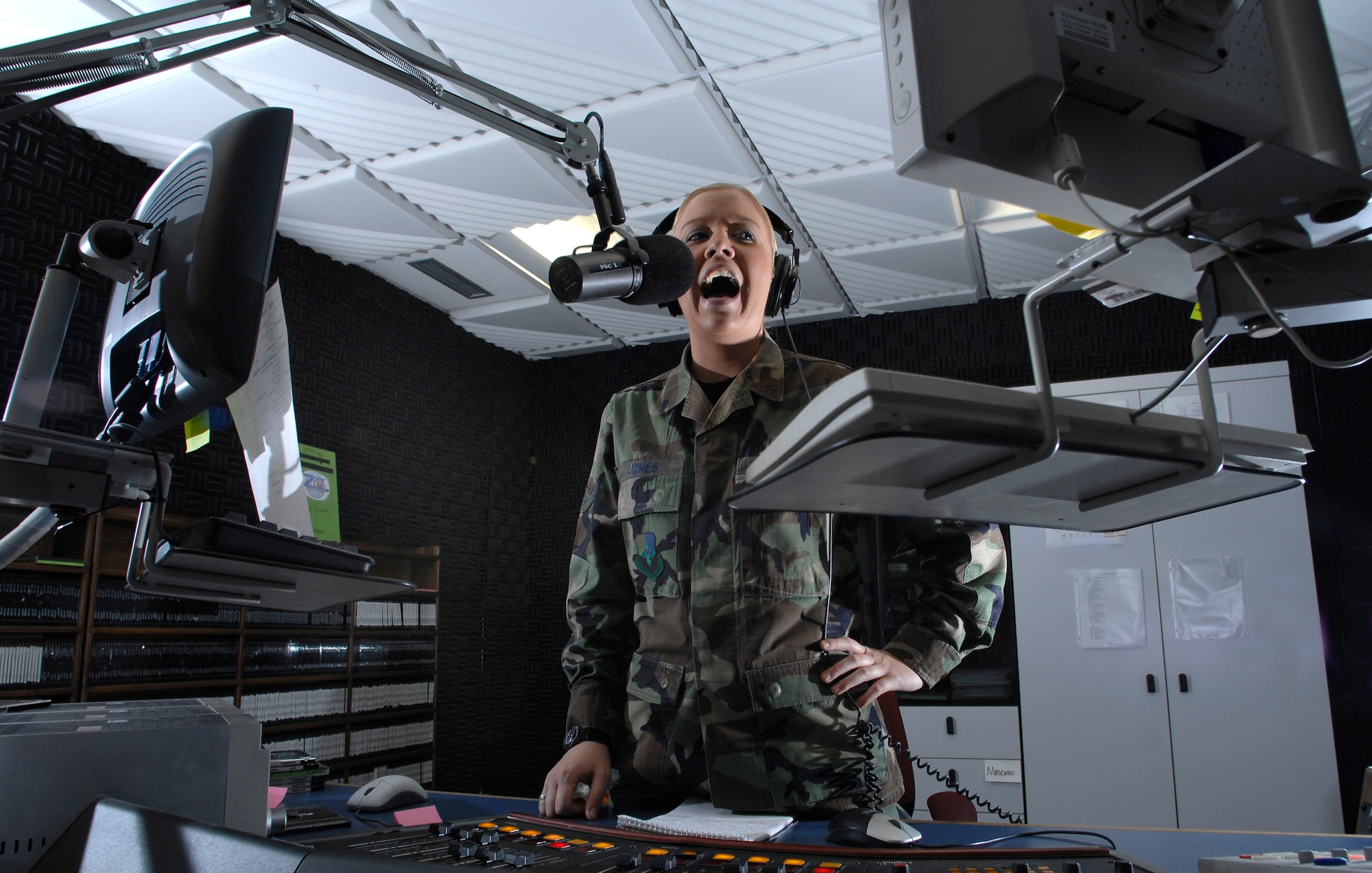 AVIANO AIR BASE, Italy --Radio DJ Airman 1st Class Caitlin Jones broadcasts live on 106 FM during her afternoon show, "The Crave" April 25 at AFN Det 8 in Area E.  Jones talks about the latest gossip, local weather updates and more on "The Crave."  (U.S. Air Force photo/Airman 1st Class Ashley Wood)   