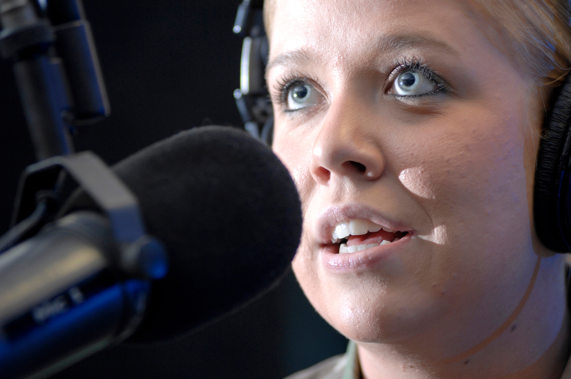 AVIANO AIR BASE, Italy --  Radio DJ Airman 1st Class Caitlin Jones broadcasts live on "The Crave," April 25.  "The Crave" runs live 10 a.m. to 2 p.m. Monday through Friday.  (U.S. Air Force photo/Airman 1st Class Ashley Wood)   