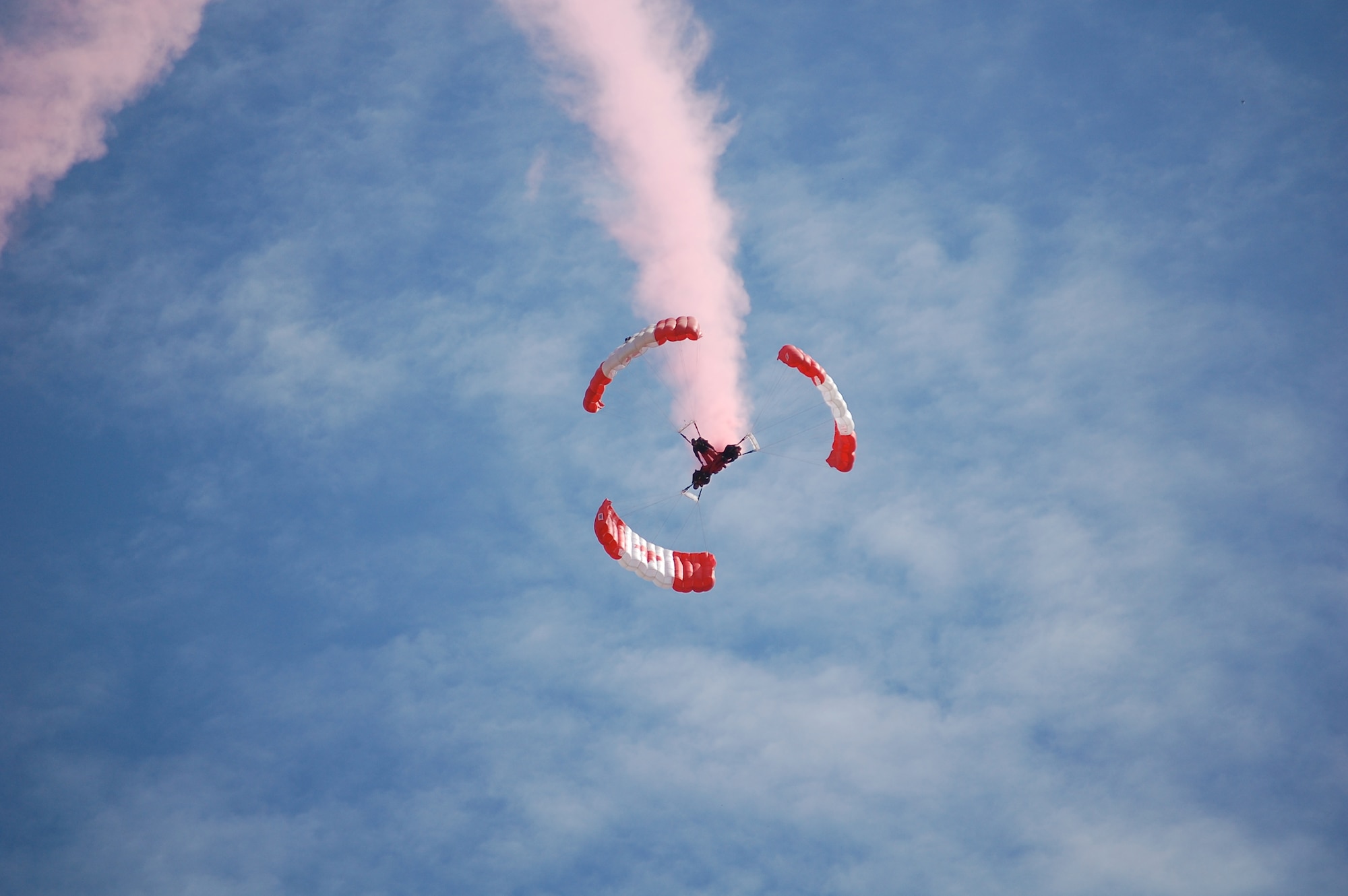 The SkyHawks are a sub-unit of the Canadian Forces Land Advanced Warfare Centre located in Trenton, Ontario. In the team’s 37-year history the Canadian Force Parachute Team – the SkyHawks – have performed around the world to an estimated 70 million spectators under our signature Canadian flag parachutes. This is their Downplane formation.
