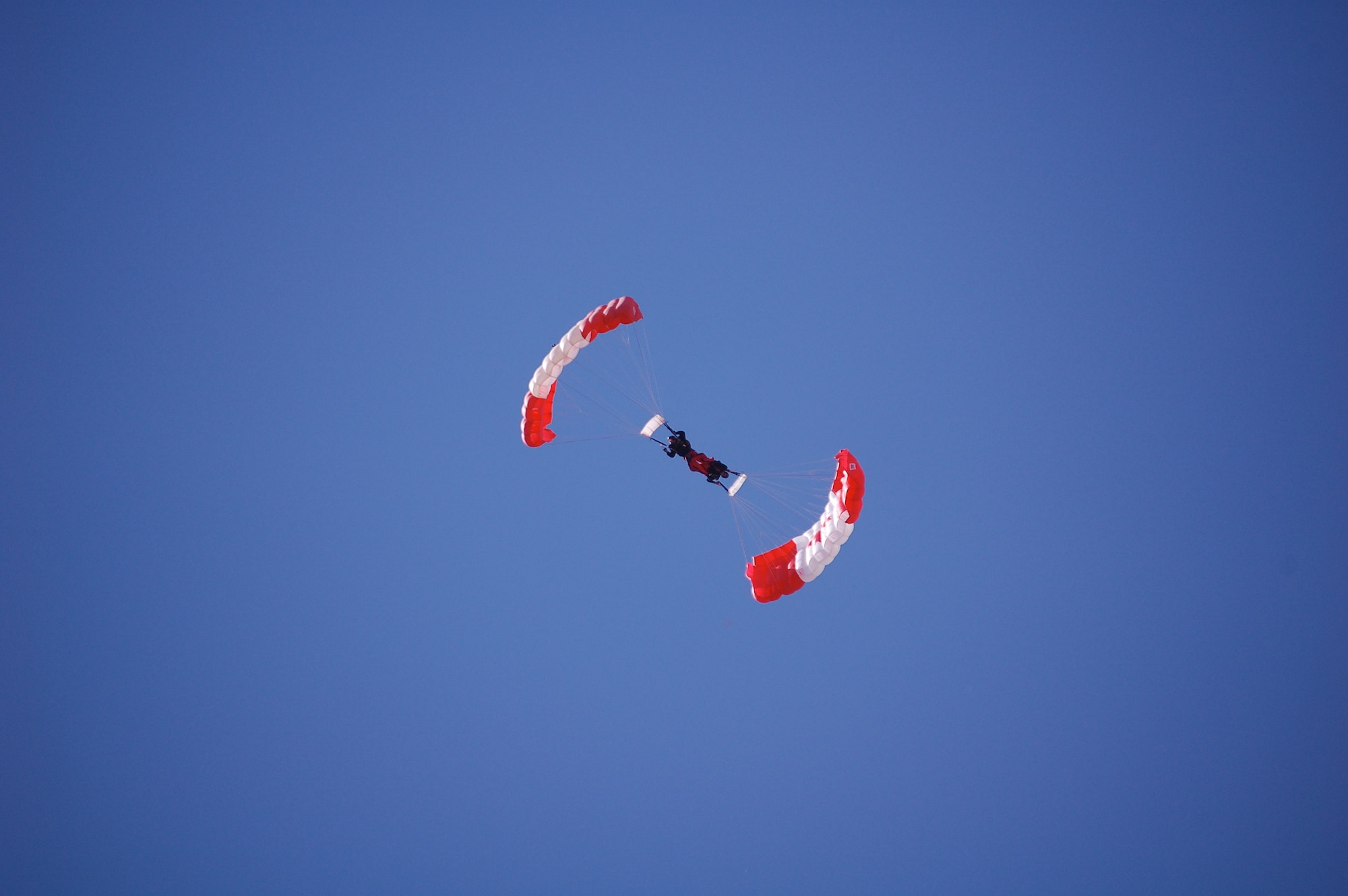 The SkyHawks are a sub-unit of the Canadian Forces Land Advanced Warfare Centre located in Trenton, Ontario. In the team’s 37-year history the Canadian Force Parachute Team – the SkyHawks – have performed around the world to an estimated 70 million spectators under our signature Canadian flag parachutes. This is their Downplane formation.
