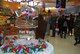 Customers check out the grand opening day specials at the Naval Air Station Joint Reserve Base Fort Worth Carswell Field Commissary on March 25. (U.S. Air Force Photo/Tech. Sgt. Julie Briden-Garcia)