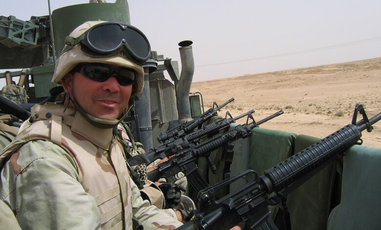 Lt. Col. Ted Luke mans the guns during a 2005 deployment to Iraq. Colonel Luke has been tagged as the new 301st Civil Engineer Squadron commander and will assume command shortly after completing a deployment to Iraq with the U.S. Army. (U.S. Air Force Photo)