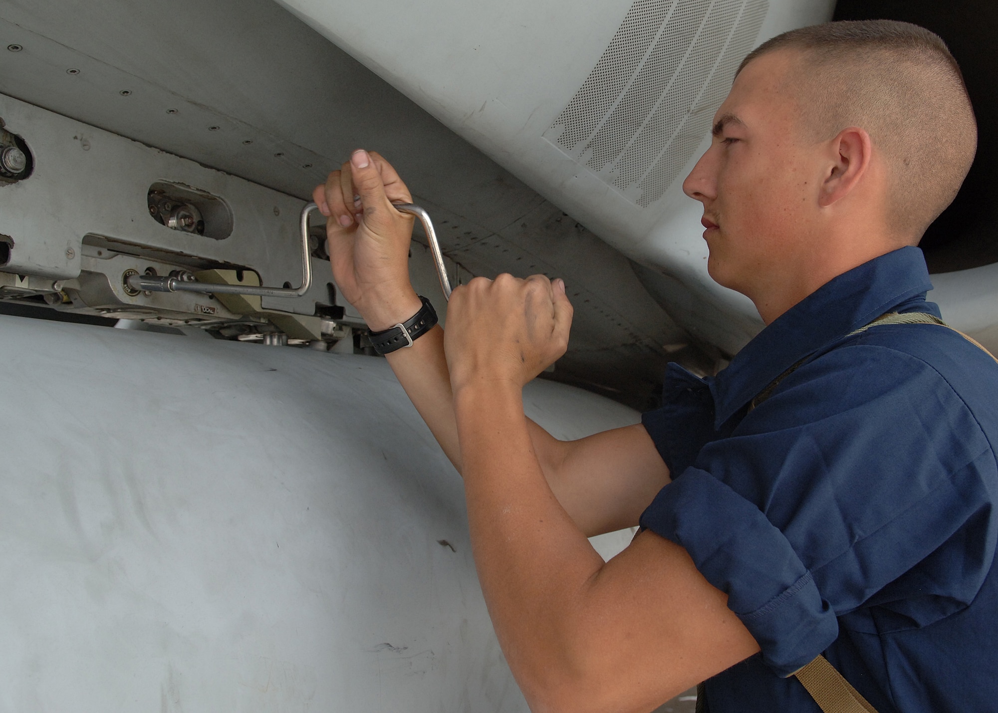 Lance Corporal Matthew Linacre of the Marine Fighter Attack Squadron checks a screw during inspection on the f-18 hornet on Holloman Air Force Base, N.M. April 11, 2008.  The Marine Fighter Attack Squadron is training here on Holloman with the f-18 hornet to prepare for an upcoming deployment.    