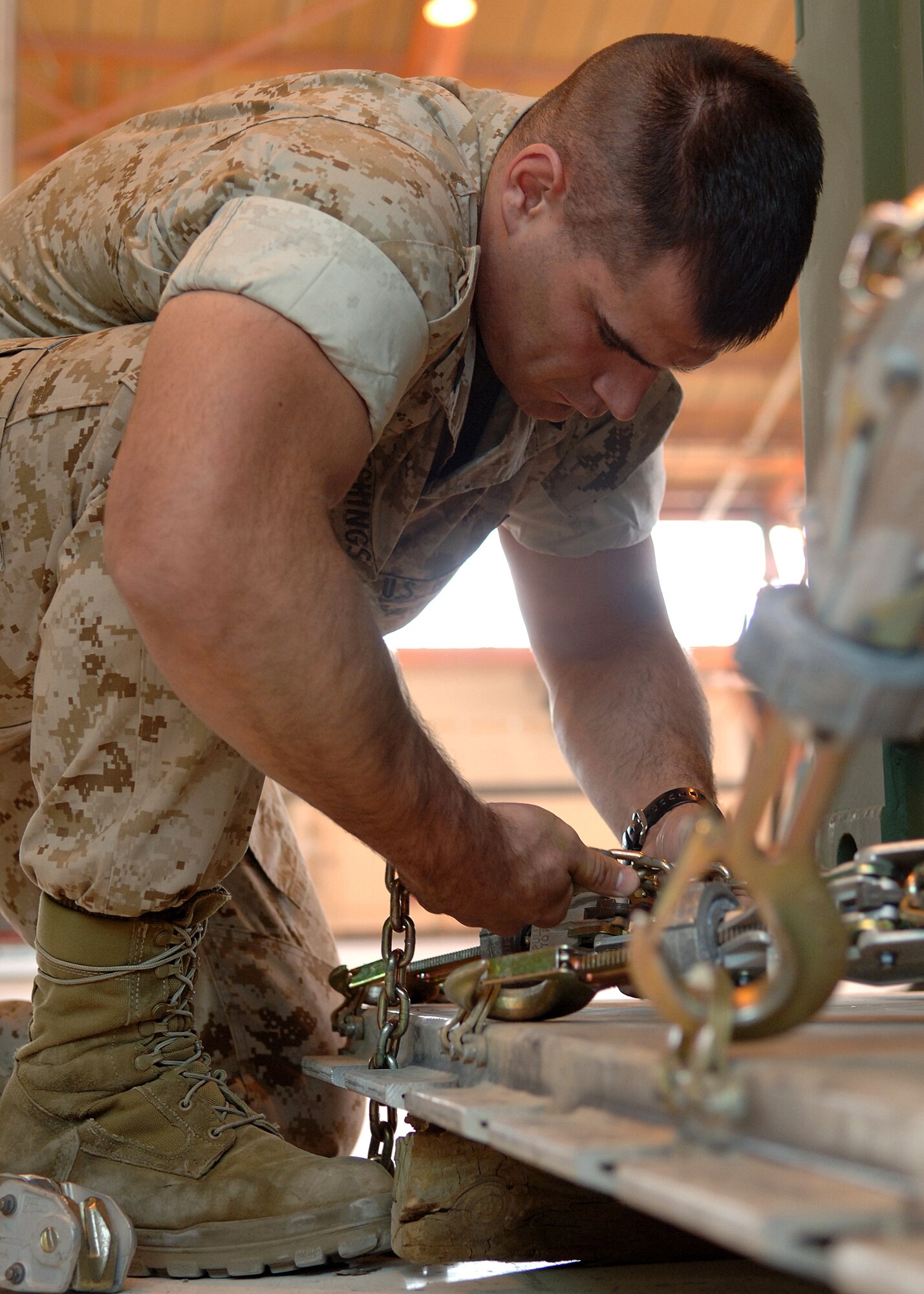Staff Sergeant Patrick Sudduth (Defensive End) of 49th Maintenance Operations Squadron protects Quarterback Anthony Hunter during a practice drill on April 12 2008 in Alamogordo N.M