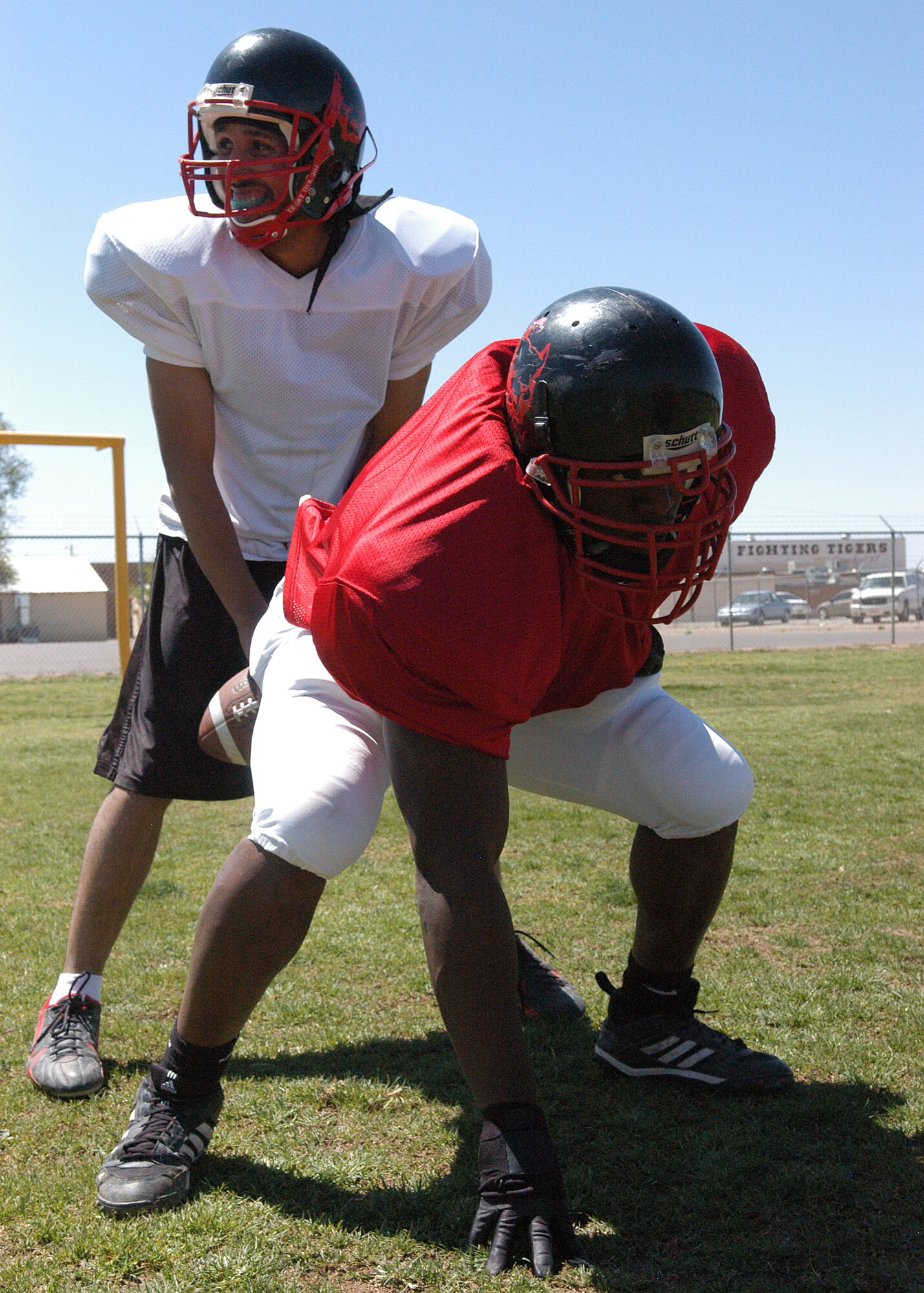 Staff Sergeant Patrick Sudduth (Defensive End) of 49th Maintenance Operations Squadron protects Quarterback Anthony Hunter during a practice drill on April 12 2008 in Alamogordo N.M.
