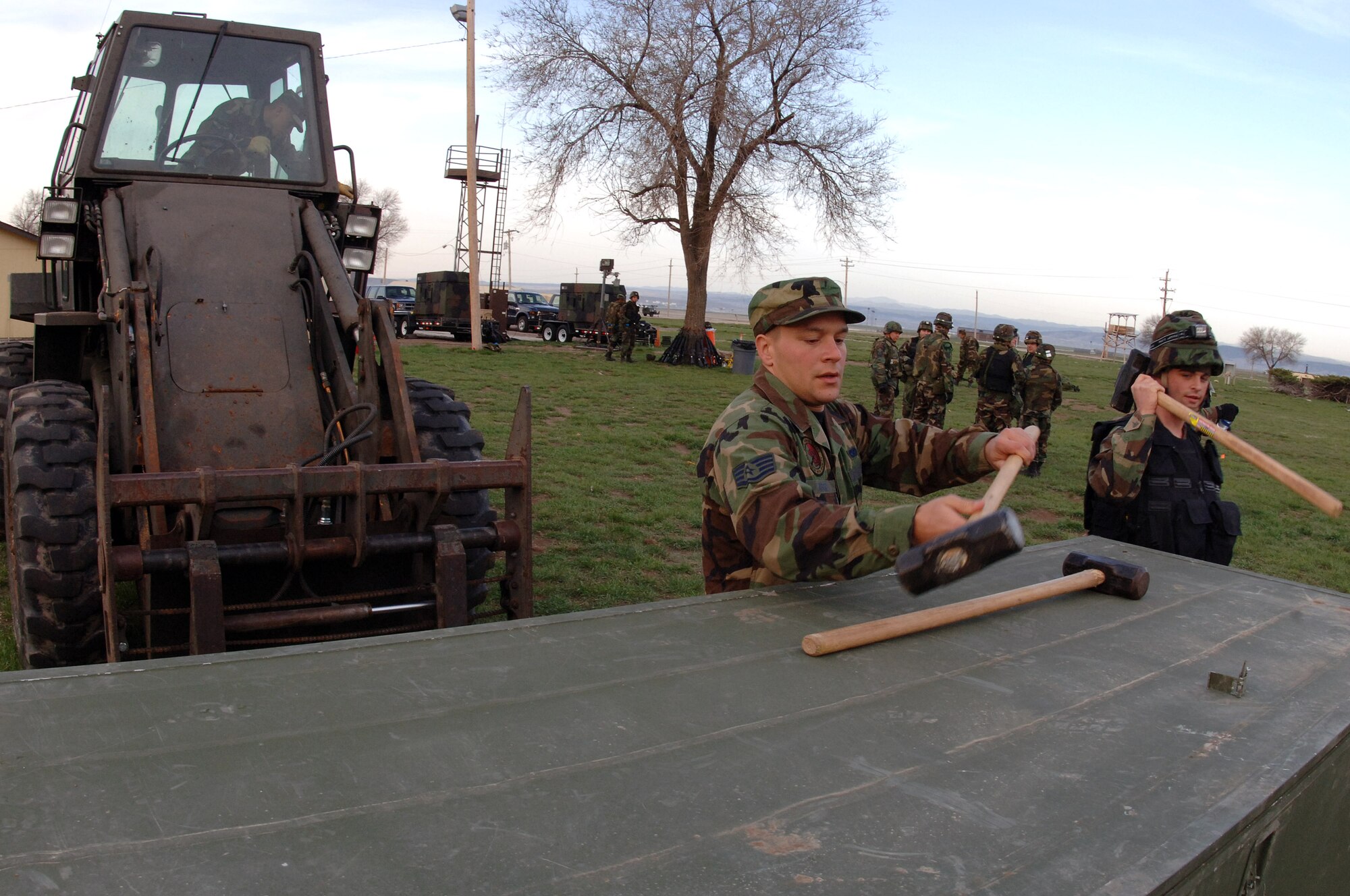 Members of the 28th Civil Engineer Squadron prepare temper tents and tools for storage during a field training exercise here on April 30. The exercise was designed to maintain combat skills necessary for small unit tactics and bare-base setup procedures. (U.S. Air Force photo/Senior Airman Marc Lane) 