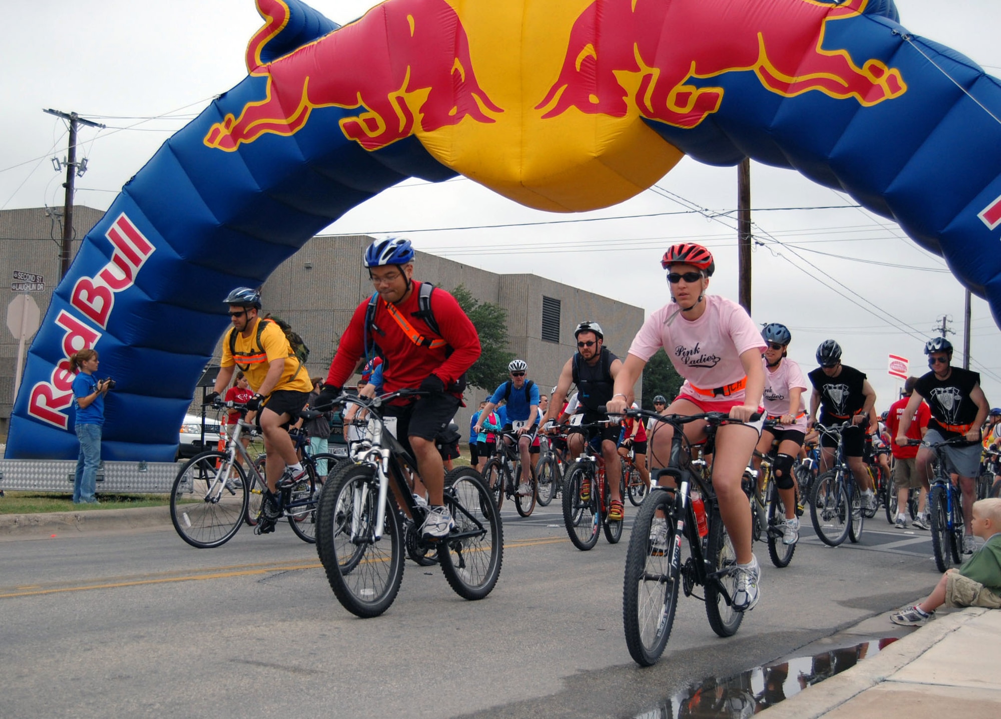 LAUGHLIN AIR FORCE BASE, Texas– Teams race off on their bikes after the signal is given at the beginning of Laughlin’s fourth annual Adventure Race April 26. The race consisted of 26-miles of biking, eight miles of running and two miles of rafting that started here and ended at Lake Amistad in Del Rio Texas. (U.S. Air Force photo by Airman 1st Class Sara Csurilla)