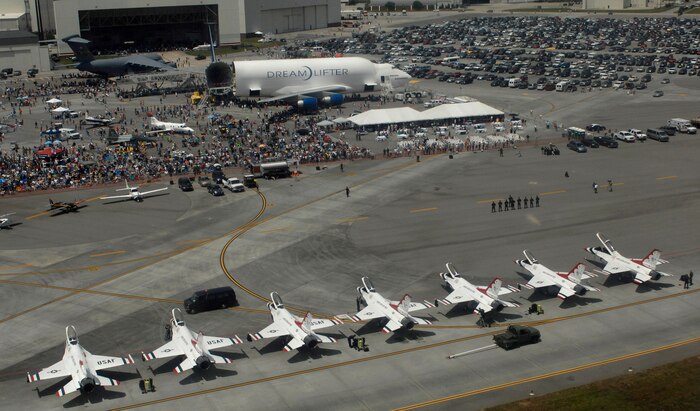 Soldiers from the Golden Knights Parachute Team conduct team introductions on the flightline after free falling to the 2008 "Wings Over Charleston" Air Expo. Visitors at the Air Expo were able to watch the Thunderbirds, C-17A Globemaster III, F-22 Raptor, F-15E Strike Eagle and other military and civilian aircraft perform. (U.S. Air Force photo/Staff Sgt. James Harper Jr.) 
