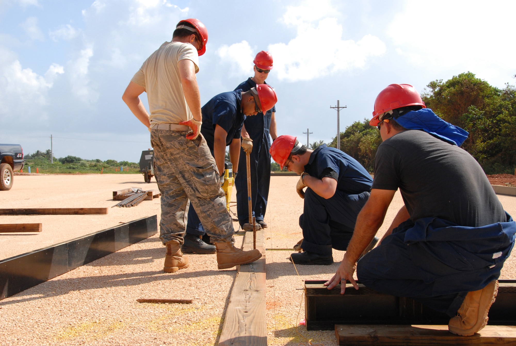 U.S. Air Force Members of 477th CES and 554th RHS structures build forms prior to pouring the concrete slab for a building at Northwest Field, Guam. The $200 million Northwest Field project will provide facilities for three squadrons and one detachment.  (U.S. Air Force photo by Capt. Torri White)