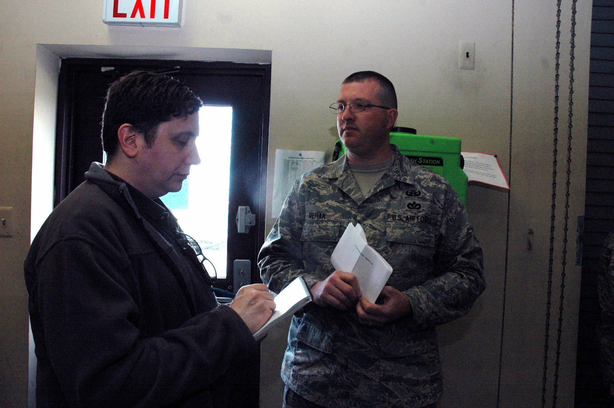 Reporter Jeff Trently from the Trenton Times of Trenton, N.J., interviews Tech. Sgt. John Rehak, 305th Civil Engineer Squadron, McGuire Air Force Base, N.J., about his recent deployment experiences April 30, 2008, on McGuire.  The interview was part of an event for Team McGuire Media Day coordinated by the 305th Air Mobility Wing Public Affairs Office.  (U.S. Air Force Photo/Tech. Sgt. Scott T. Sturkol)