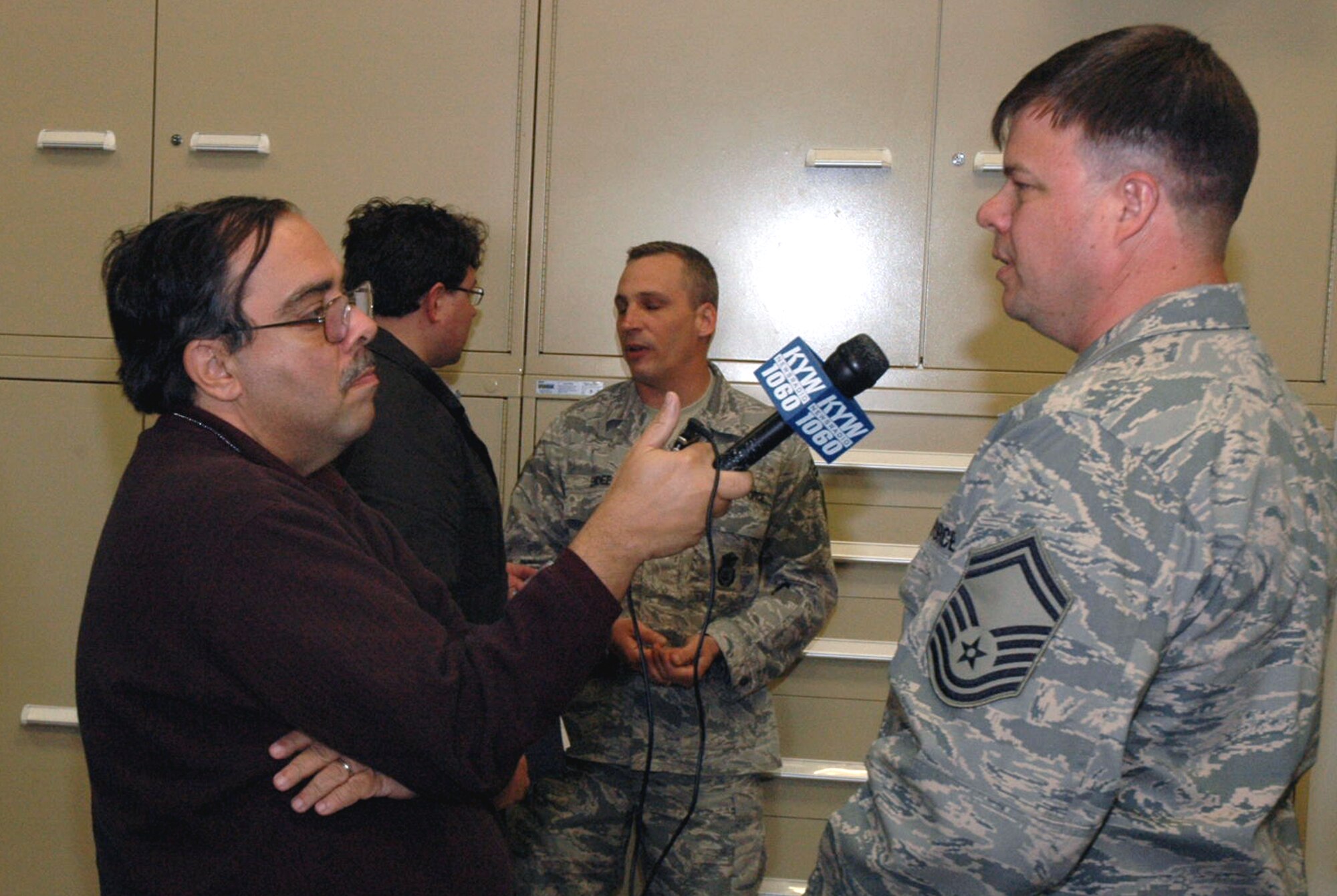 Reporter David Madden from KYW 1060 AM of Philadelphia, Penn., interviews Senior Master Sgt. Kevin Savidge, 514th Aeromedical Evacuation Squadron, McGuire Air Force Base, N.J., about his recent deployment experiences April 30, 2008, on McGuire.  The interview was part of an event for Team McGuire Media Day coordinated by the 305th Air Mobility Wing Public Affairs Office.  (U.S. Air Force Photo/Tech. Sgt. Scott T. Sturkol)