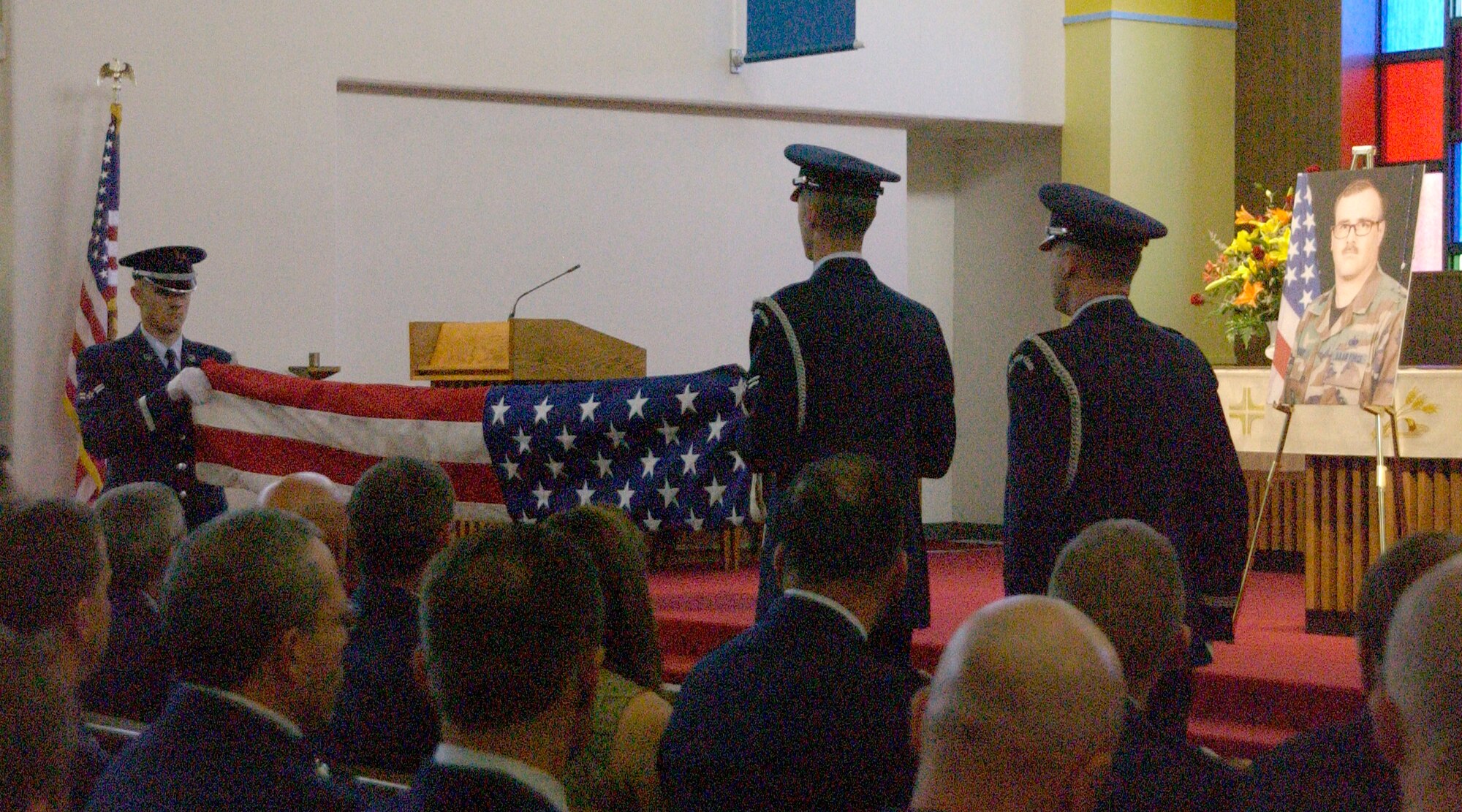 CANNON AIR FORCE BASE, N.M. -- Base Honor Guardsmen fold a flag at a memorial service for Senior Master Sgt. John Chesley, who died from cancer on April 26. Sergeant Chesley was the superintendent of the Materiel Management Flight and was assigned to the 27th Special Operations Logistics Readiness Squadron. He entered the Air Force in 1982 and arrived at Cannon for duty in 2003. Sergeant Chesley was 46 years old. (U.S. Air Force photo by Airman Maynelinne De La Cruz)                              