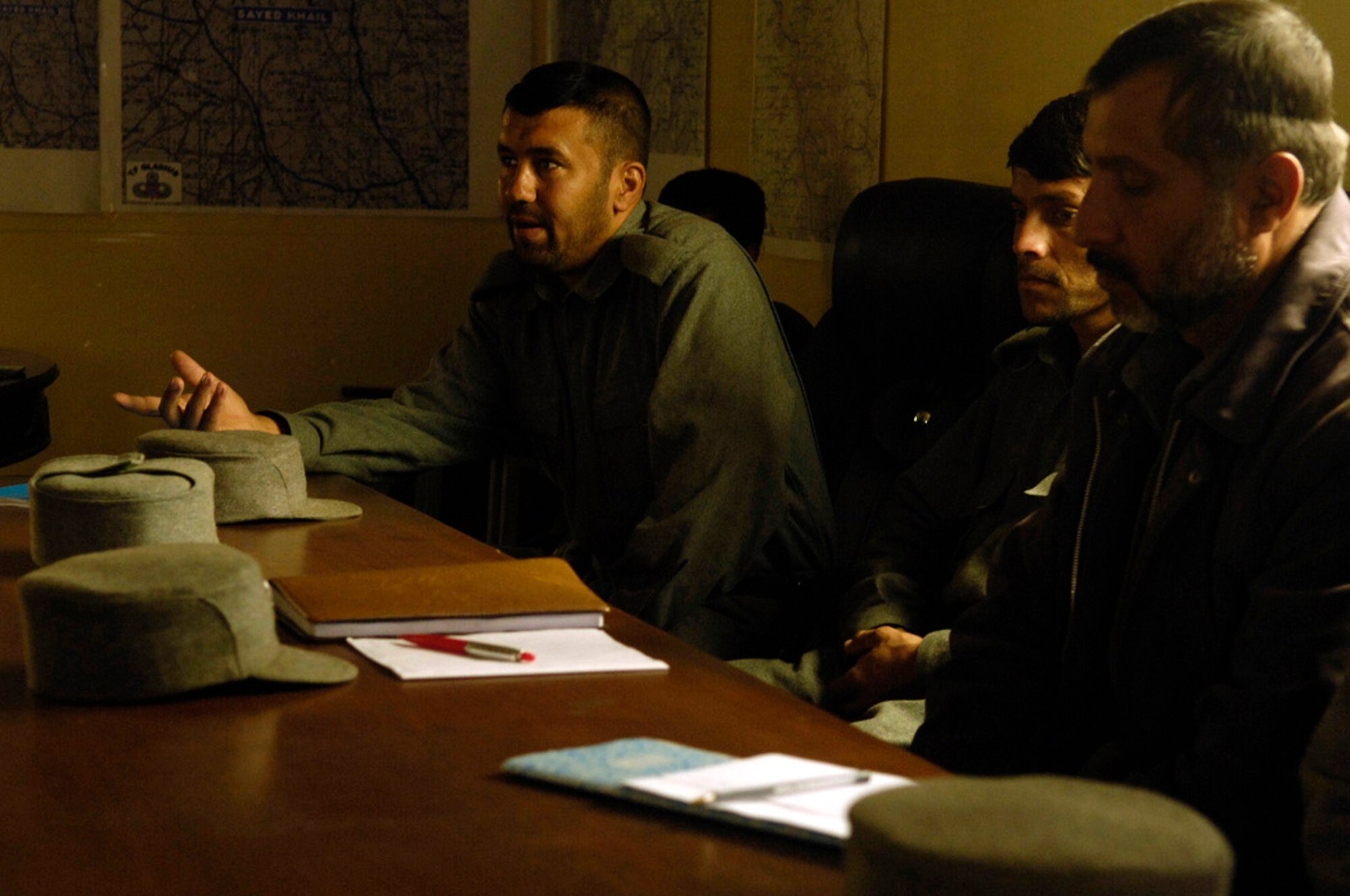 An Afghan National Police officer answers a question during a training class conducted by Airmen assigned to the Provincial Reconstruction Team's Bagram Police Technical Advisory Team April 22 at the Parwan Provincial ANP Headquarters in the Charikar District.   (U.S. Air Force photo/Master Sgt. Andy Dunaway)