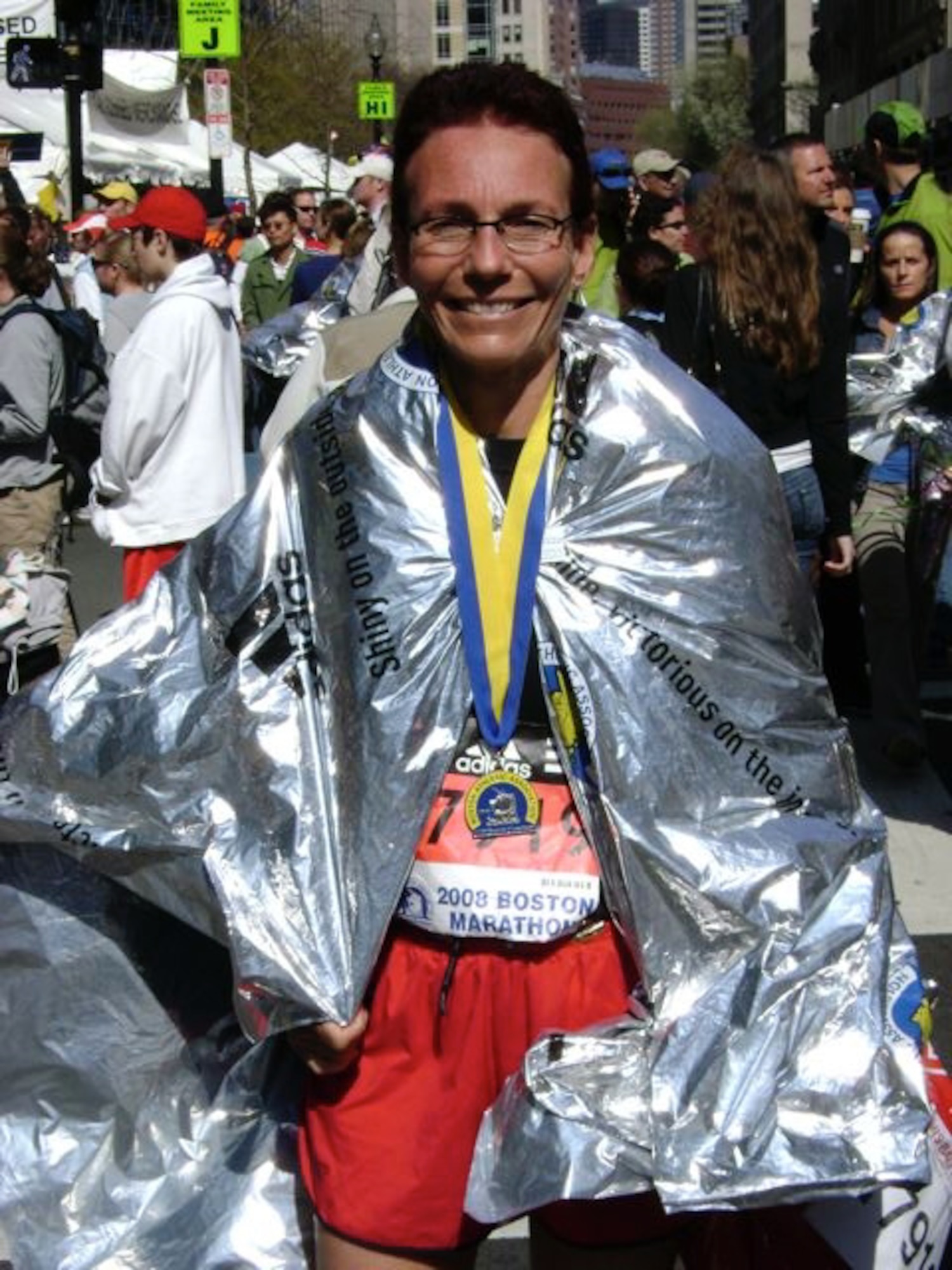 Maj. Marie McIntee cools down after completing the 2008 Boston Marathon April 21.  She finished the marathon with a time of 3 hours, 39 minutes, 18 seconds, and was wrapped in a foil blanket given to all runners at the end of the marathon to help keelp them warm.  (Submitted Photo/ David McIntee)