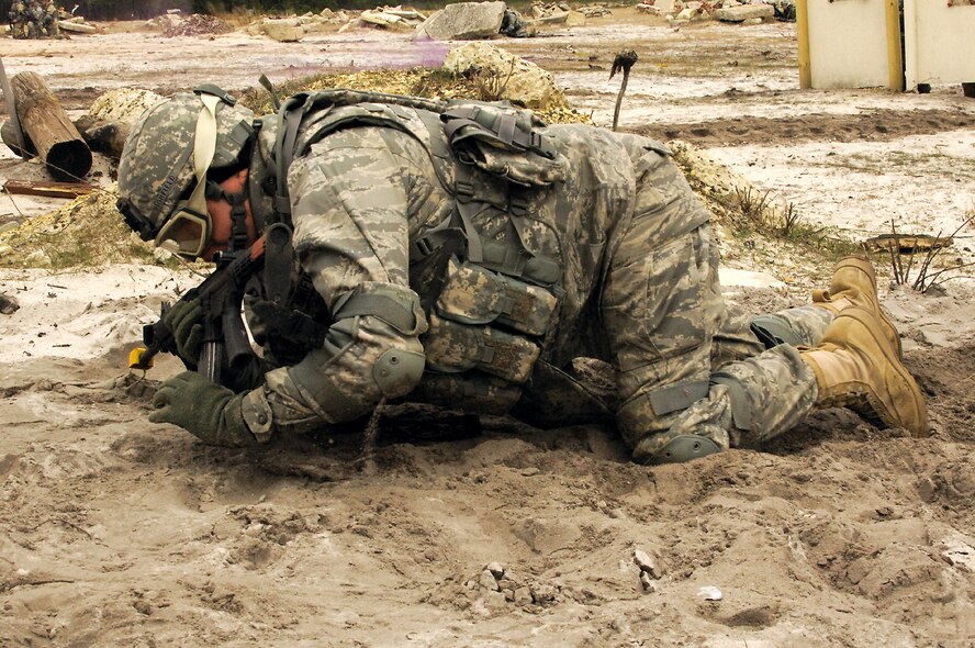 Lt. Col. Kevin Highfield low crawls to the next point during Individual Movement Technique training at the Fort Dix, N.J., improvised explosive device range.  The training teaches troops how to conduct maneuvers in an unknown, often hostile, environment.  Colonel Highfield and his fellow Airmen, members of USAF Class 25, are completing the Soldier Skills Training Course as they prepare for various deployments around the globe.  There are about 75 Airmen currently going through the month-long course.   (U.S. Army photo)