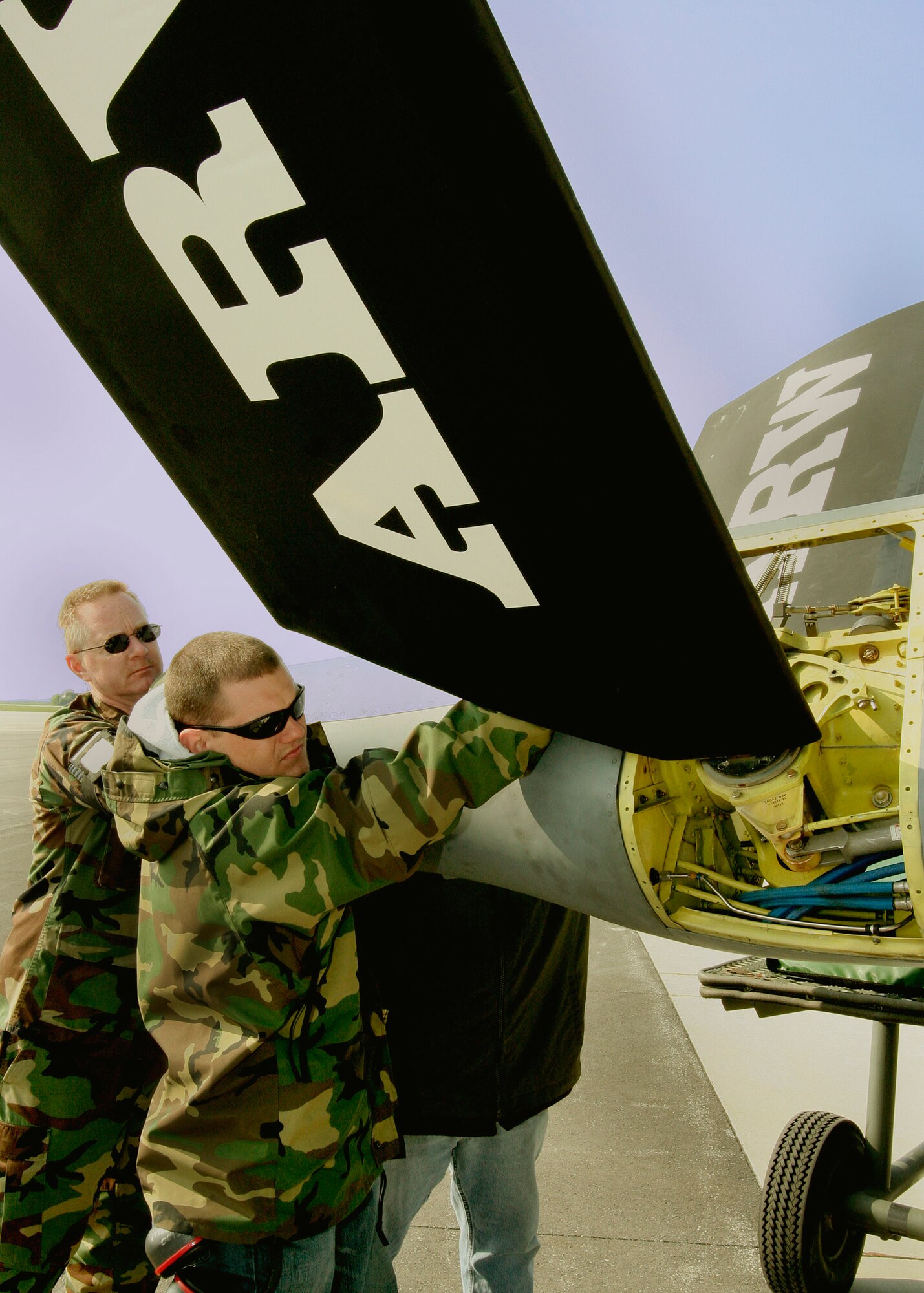 GRISSOM AIR RESERVE BASE, Ind.,-- Tech. Sgt. Kevin Hutchison, aircraft hydraulic system mechanic, and Senior Airman Joe Meyer, crew chief, help guide the tail end of a refueling boom to be reattached on a KC-135R Stratotanker.  Personnel from the 434th Maintenance Group take great pride in maintaining the 434th Air Refueling Wing's fleet of KC-135 Stratotankers. (U.S. Air Force Photo/Tech. Sgt. Patrick M. Kuminecz)  