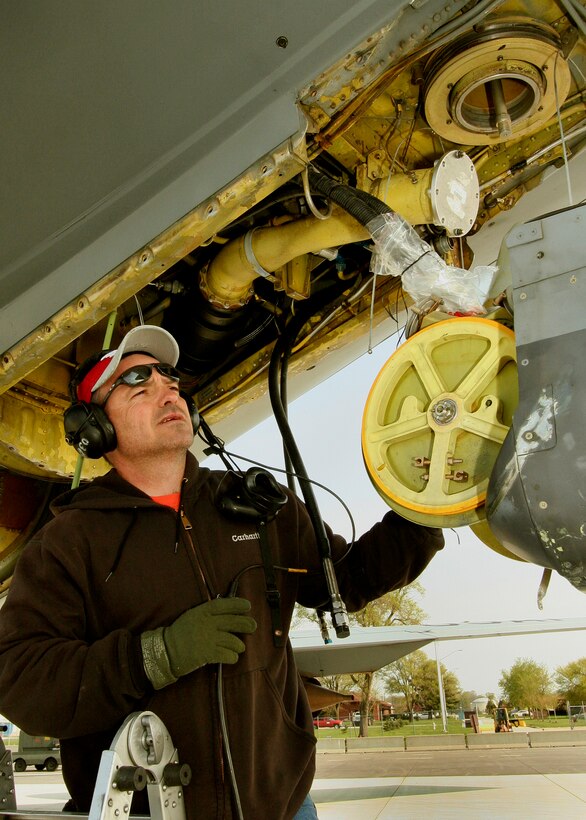 GRISSOM AIR RESERVE BASE, Ind., -- Tech. Sgt. Randy Brooks, an aircraft hydraulics system mechanic with the 434th Maintenance Group, visually guides the front of a refueling boom as it is reattached on a KC-135R Stratotanker. The 434th Air Refueling Wing and its fleet of KC-135 Stratotankers provide mid-air refueling to bomber, fighter and cargo aircraft. (U.S. Air Force Photo/Tech. Sgt. Patrick M. Kuminecz)