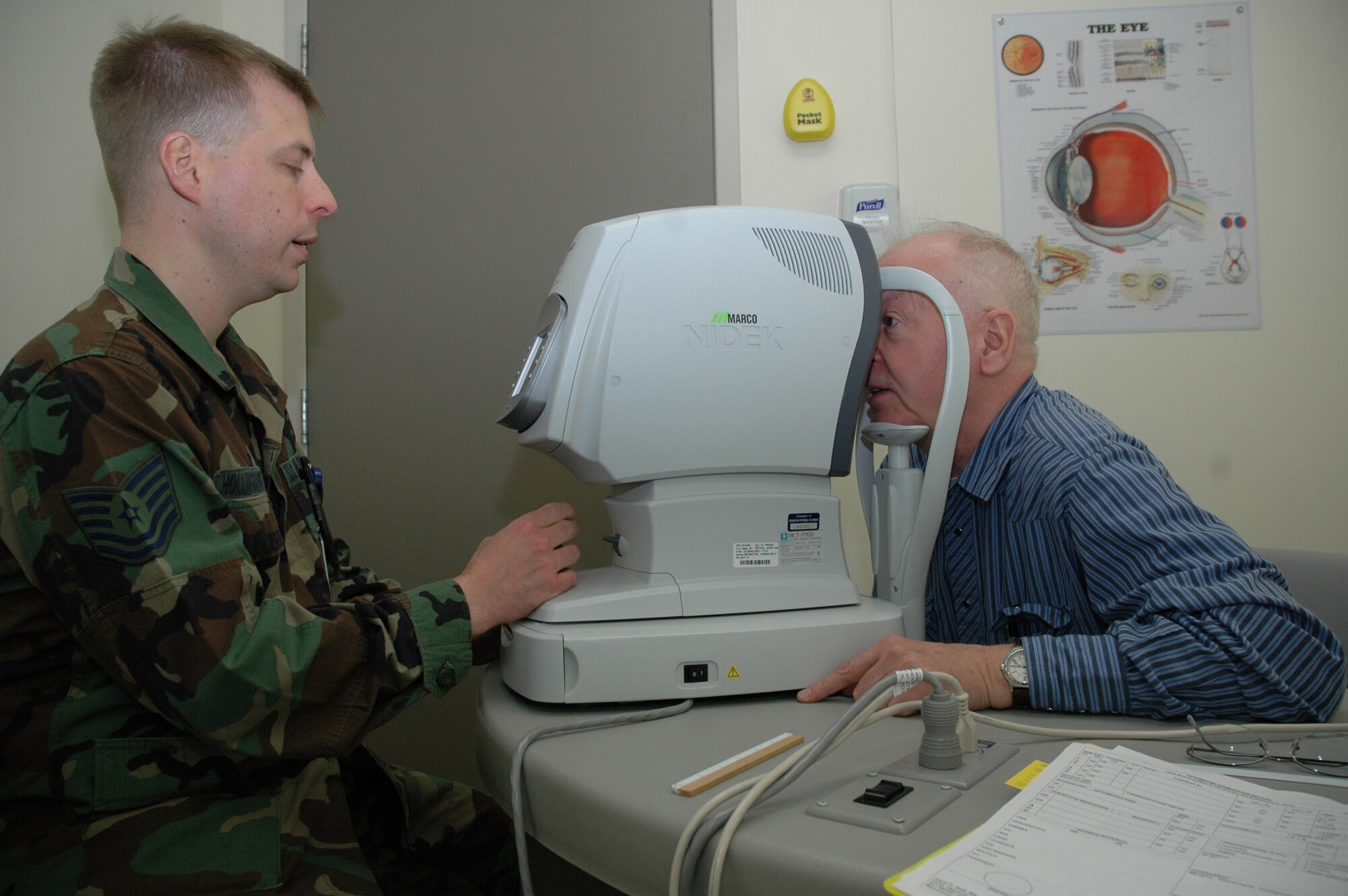 Tech. Sgt. Brian Hollingsworth, 341st Medical Operations Squadron optometry NCOIC, screens retired Lt. Col. Charles Bickle during an optometry appointment at the base clinic. Eye exams were just one of many services offered to the retirees April 26 during Retiree Appreciation Weekend. (U.S. Air Force photo/Airman 1st Class Emerald Ralston)