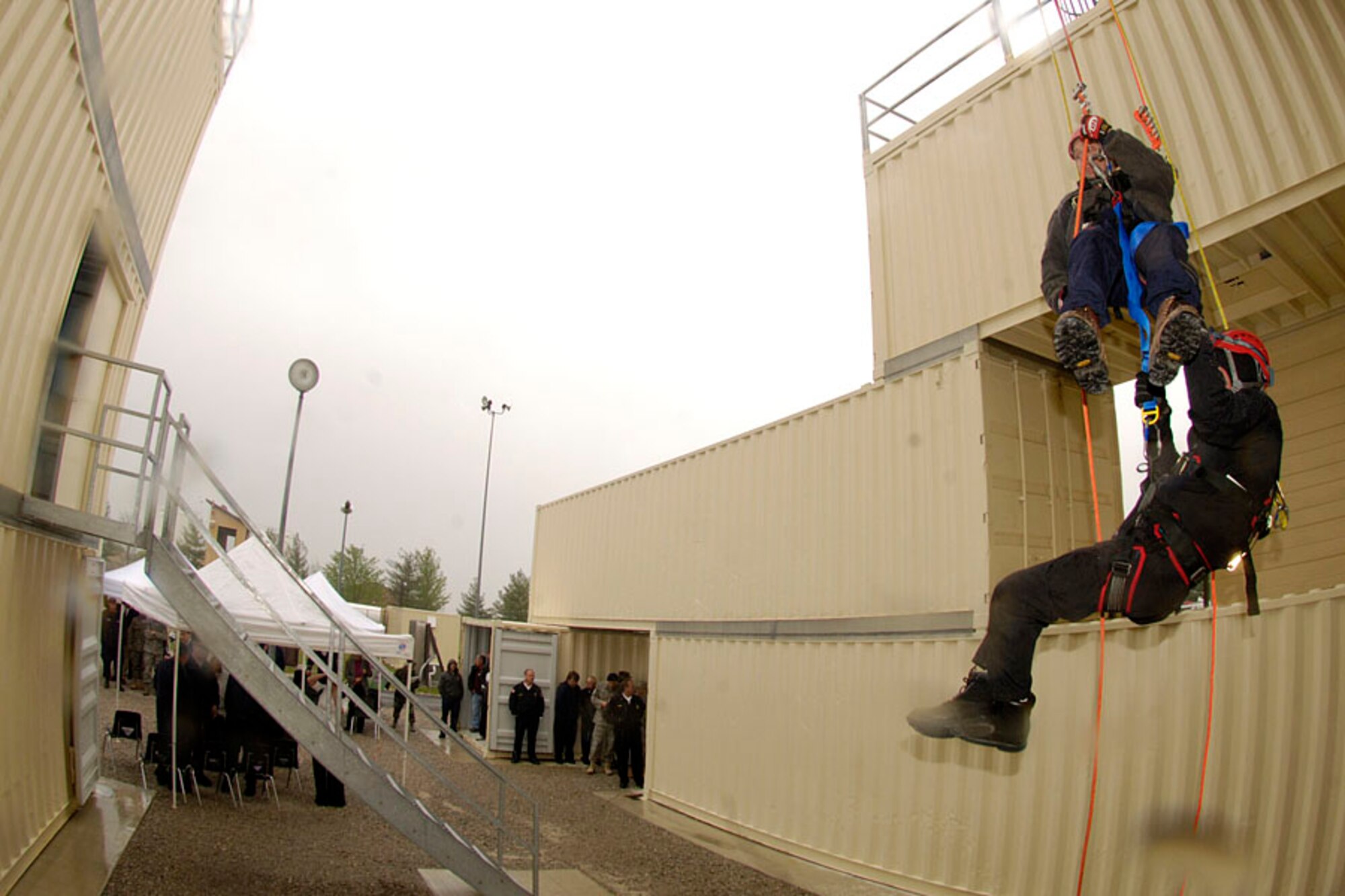 SCOTT AIR FORCE BASE, Ill. -- Members of the St. Clair County Special Emergency Services team demonstrate rope rescues at the new $300,000 technical rescue training facility opened at Scott Air Force Base Monday. The ribbon cutting ceremony was attended by several area politicians including U.S. Representative Jetty Costello. (U.S. Air Force photo/Senior Airman Jonathan Lovelady)