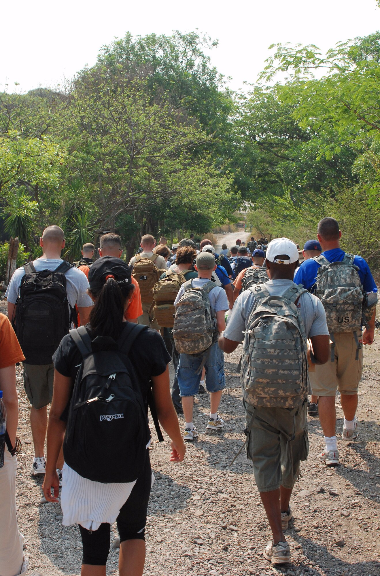 Joint Task Force-Bravo personnel begin their hike to deliver two and one half tons of staple foods to two villages near Humuya, Honduras, April 26. The three-mile hike was part of JTF-Bravo's ongoing chapel hike program. (U.S. Air Force photo/1st Lt. Erika Yepsen)
