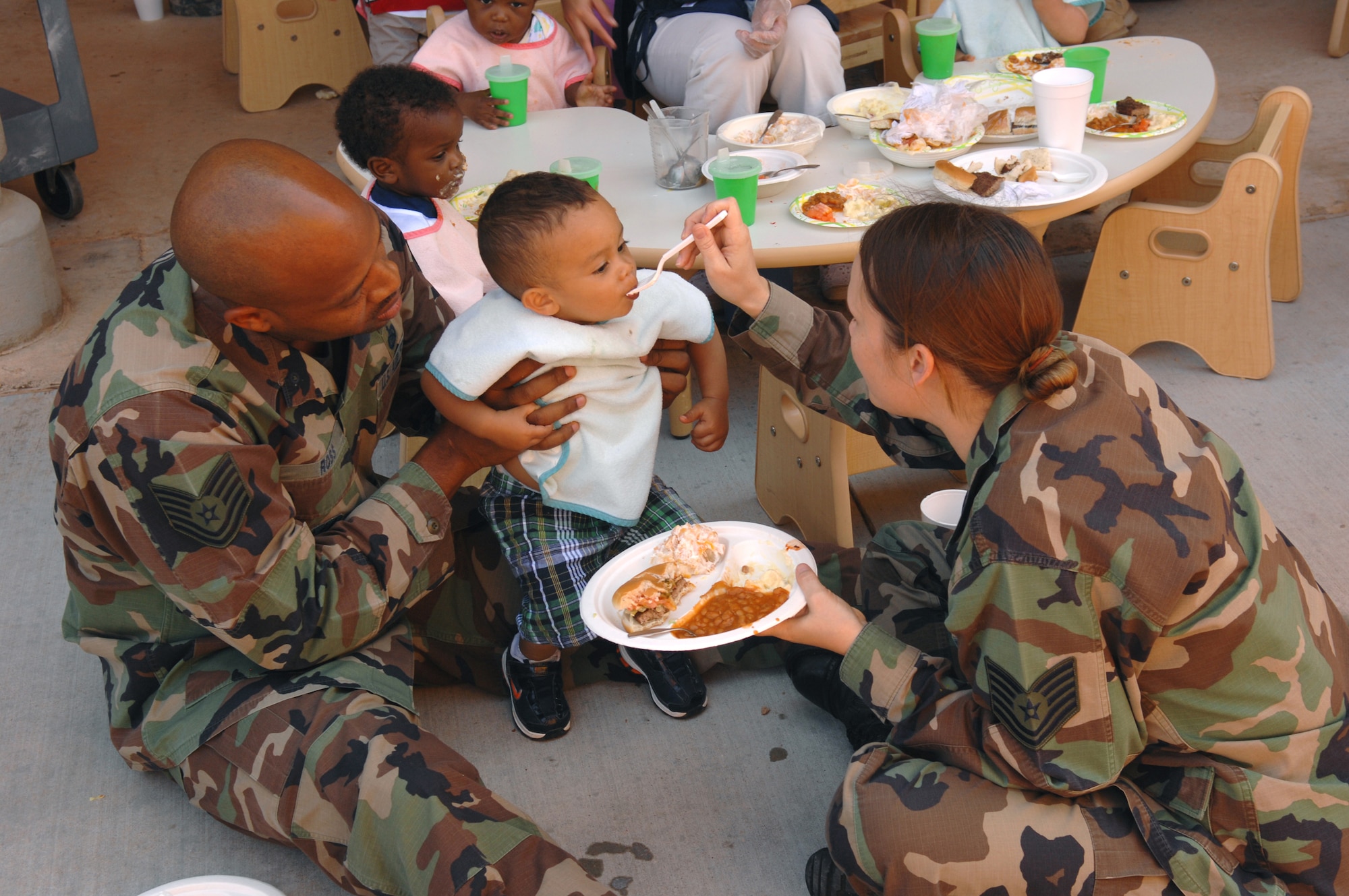 DYESS AIR FORCE BASE, Texas -- Technical Sgt. Maurice and Tina Ross spend time with their son, Darius at the Month of Military Child barbeque April 24. (U.S. Air Force photo by Airman 1st Class Stephen Reyes) 