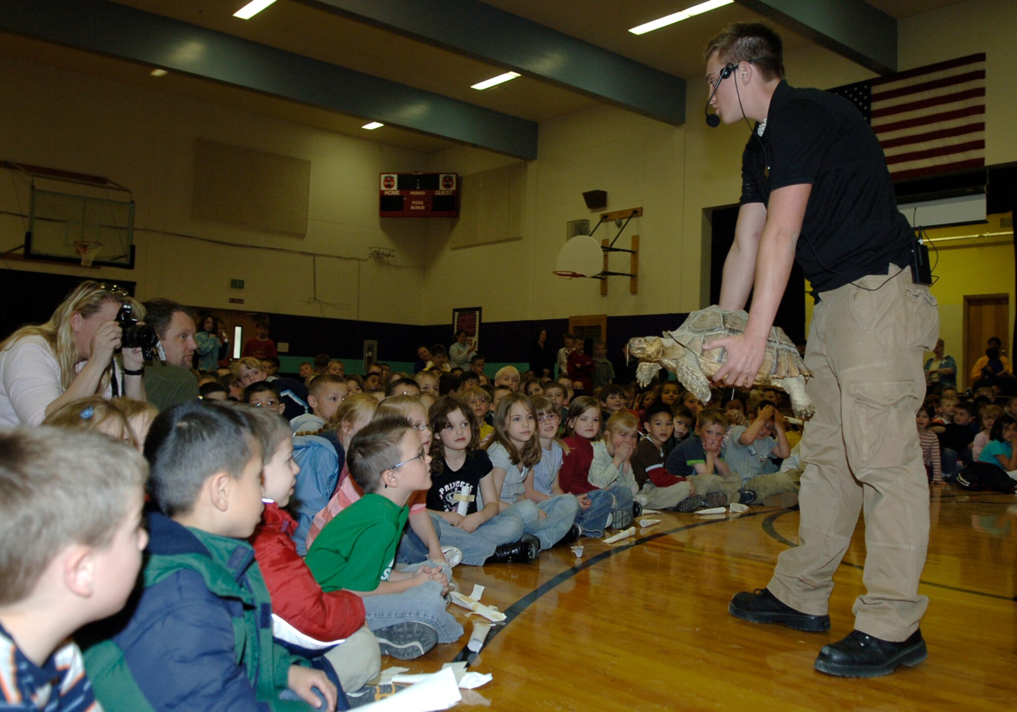 MOUNTAIN HOME AIR FORCE BASE, Idaho -- Corbin Maxey, The Reptile Guy, introduces students from the Base Primary School to Tank, an African tortoise, during Science Day at Stephensen Middle School April 25. The Mountain Home Air Force Base Parent Teacher Partnership hosted Science Day to introduce students from kindergarten through fourth grade to the world of science. (U.S. Air Force photo/Airman 1st Class Samantha S. Crane)