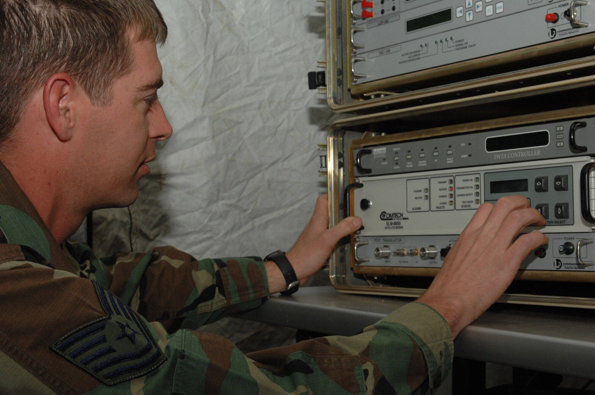 DIVULJE TRAINING BASE, Croatia – U.S. Air Force Tech. Sgt. Brett Olsen, 1st Combat Communications Squadron, Ramstein Air Base, Germany, adjusts a USC 6 Satellite Modem here April 29. Olsen is part of the forward team supporting Medical Central and Eastern Europe Exercise 2008 (MEDCEUR 08). Seventeen nations are participating in the exercise May 2 through 15. The exercise focuses on mass-casualty training scenarios and humanitarian aid in response to crises situations. More than 400 multi-nationals are attending the exercise in support of the Partnership for Peace initiative. (U.S. Air Force photo/Staff Sgt. Kristin Ruleau)