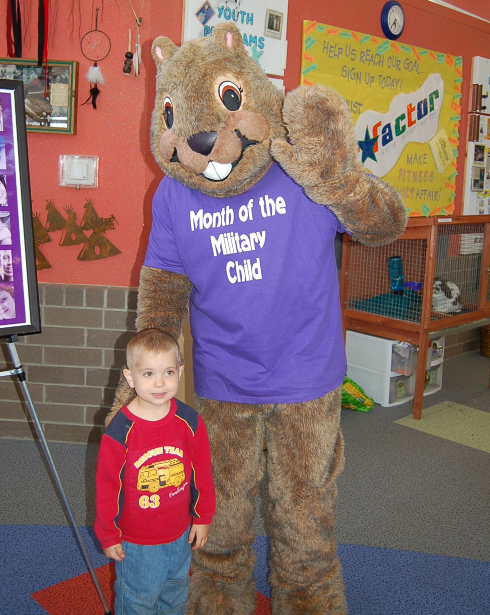MINOT AIR FORCE BASE, N.D. -- Darby, the 5th Force Support Squadron mascot, poses with Ethan Mattair, son of Lisa and Staff Sgt. Frank Mattair, 5th Munitions Squadron, during the Kid’s Block Party at the Youth Center on Minot Air Force Base April 25. Ethan was the winner of an annual family pass to Roosevelt Park Zoo. Over $600 in prizes were awarded to children who registered at 5th FSS facilities as part of the base's observance of Month of the Military Child. Other winners included Pheobe Kent, Hunter Merwin, Westin Richmond, Trinity Bauer, Ezrael Haffner, William Nelson, Sam McCarty and Abby Gautreaux. (Courtesy photo)