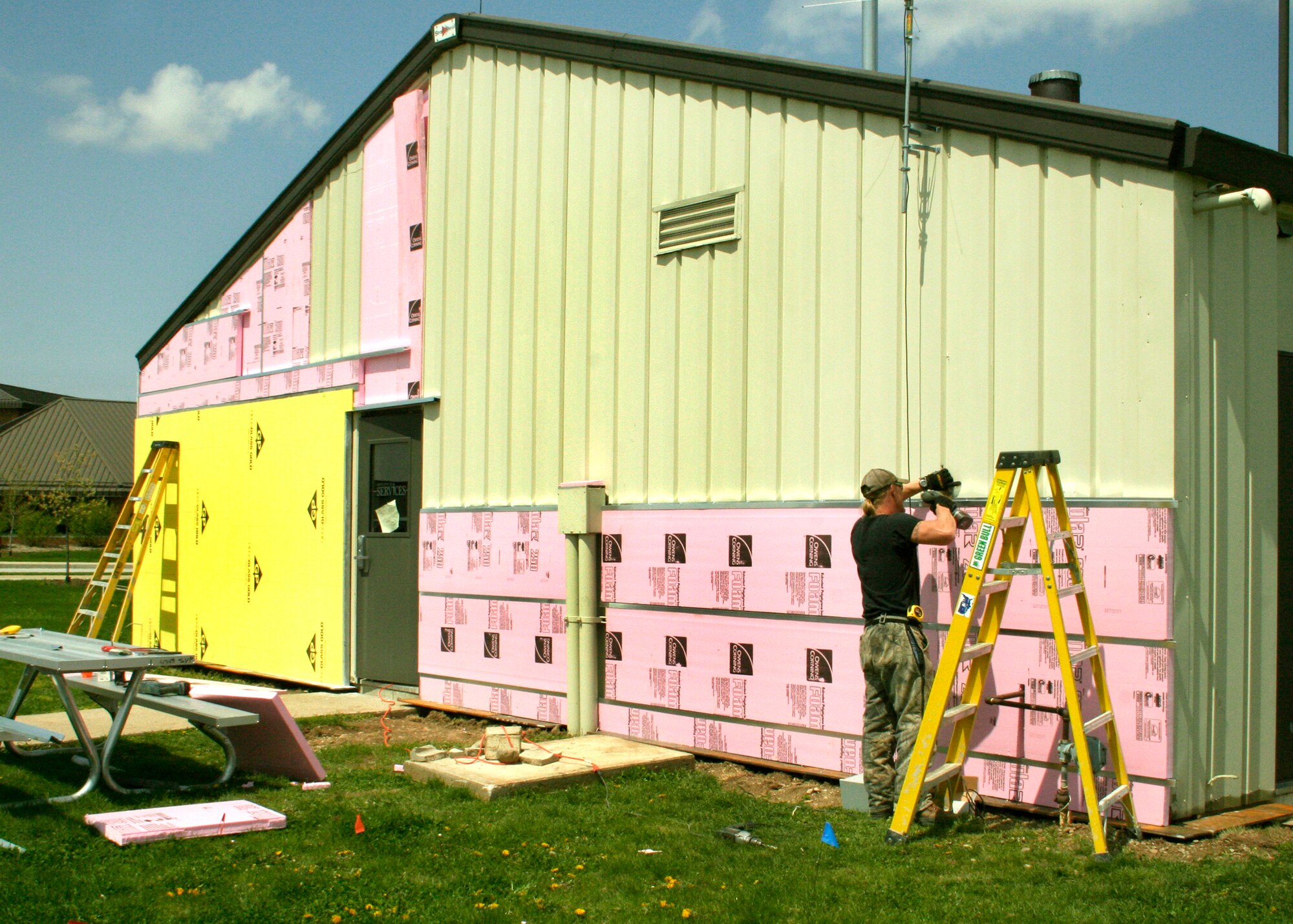 GRISSOM AIR RESERVE BASE, Ind., -- Norm Colbert of the Belco company reinforces the new siding that is going up at Chocks.  The siding is only a part of a renovation that is being done at the all-ranks club.  The siding is only the first step in the total refurbishment of the all-ranks club.  (U.S. Air Force Photo/Tech. Sgt. Patrick M. Kuminecz)