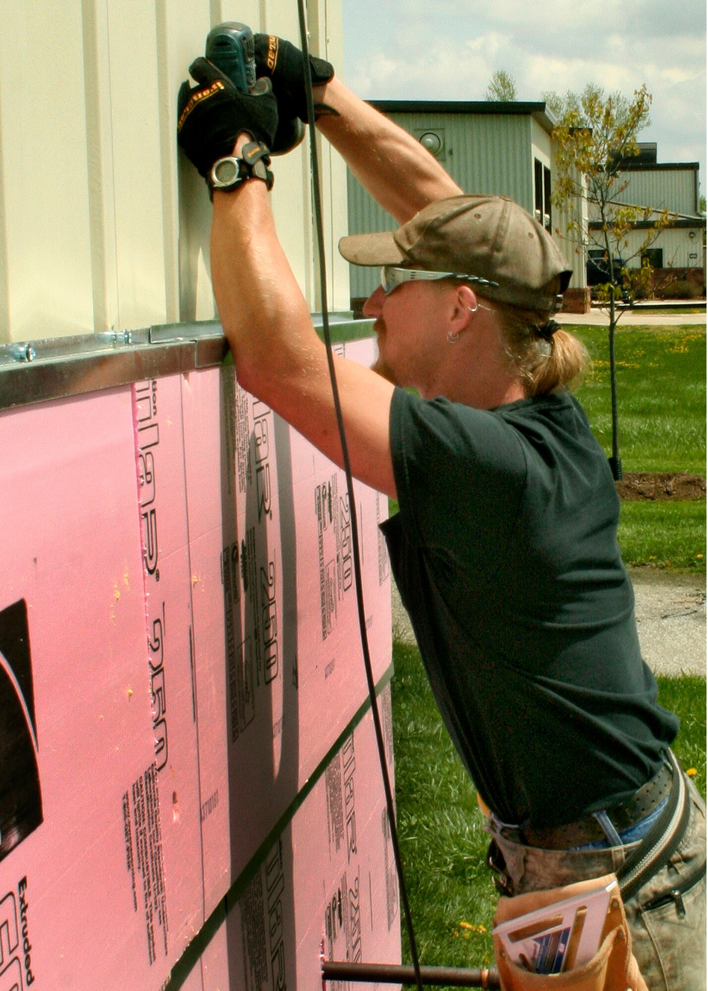GRISSOM AIR RESERVE BASE, Ind., -- Norm Colbert of the Belco company reinforces the new siding that is going up at Chocks.  The siding is only a part of the renovation that is currently taking place at the all-ranks club.  Further renovations will begin soon.  (U.S. Air Force Photo/Tech. Sgt. Patrick M. Kuminecz)