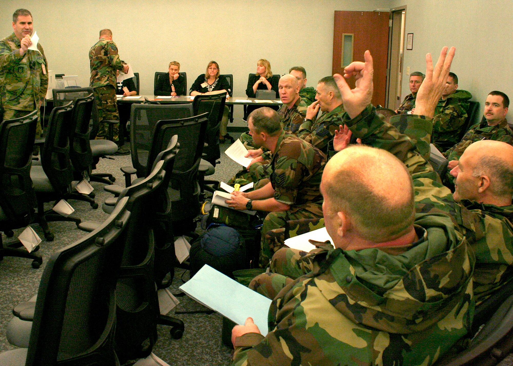 GRISSOM AIR RESERVE BASE, Ind., -- Senior Master Sgt. Dan DeAngulo, superintendent of the 434th Mission Support Flight, briefs deployers before they start through the mobility processing line.  Grissom deployers must process prior to departure on any deployment.  (US Air Force Photo/Tech. Sgt. Patrick M. Kuminecz)