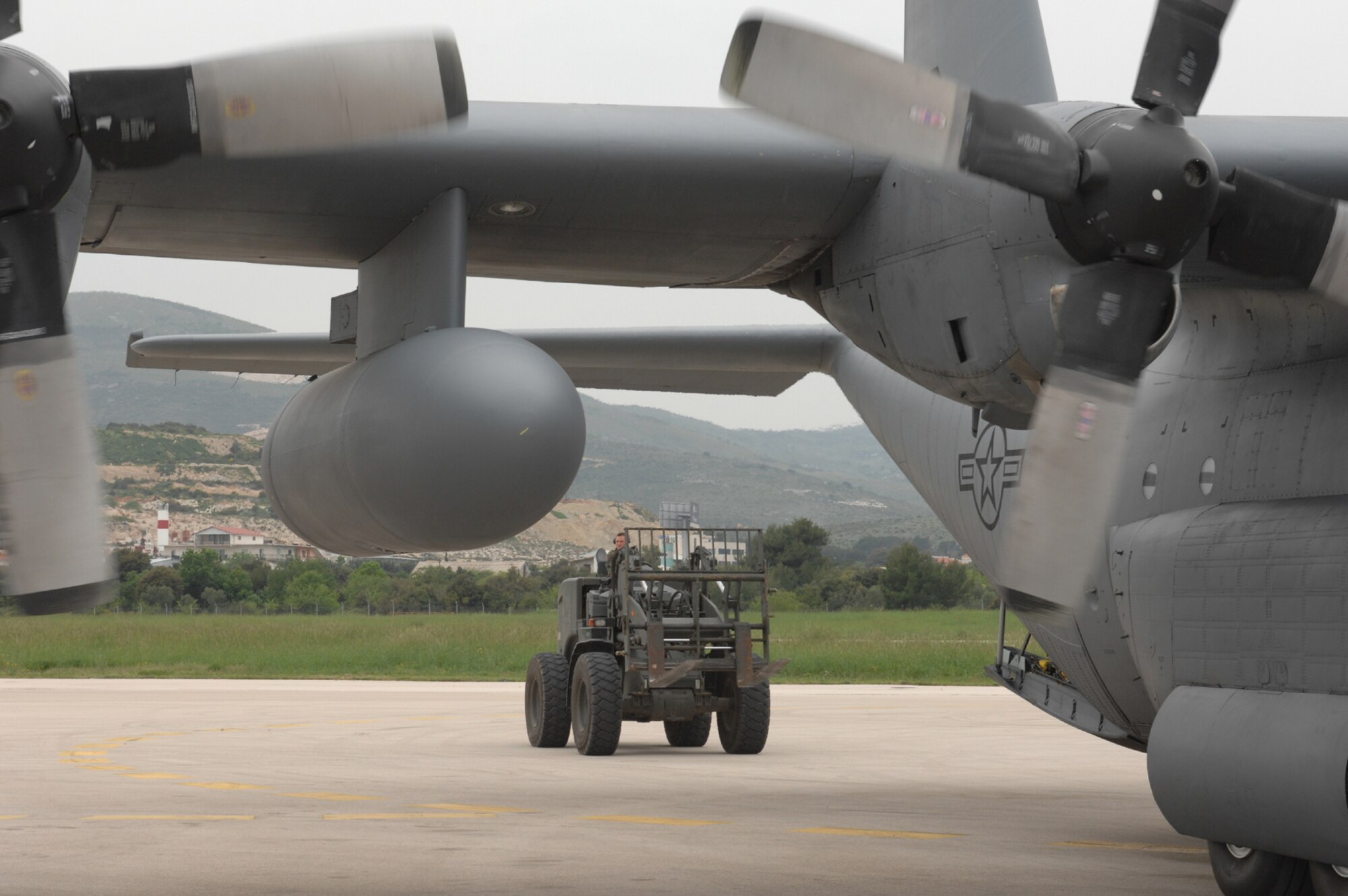 DIVULJE TRAINING BASE, Croatia – A U.S. Air Force Contingency Response Group Airman from Ramstein Air Base, Germany, unloads cargo from a U.S. C-130 here April 29 for the Medical Central and Eastern Europe Exercise 2008 (MEDCEUR 08). Seventeen nations are participating in the exercise May 2 through 15. The exercise focuses on mass-casualty training scenarios and humanitarian aid in response to crises situations. More than 400 multi-nationals are attending the exercise in support of the Partnership for Peace initiative. (U.S. Air Force photo/Staff Sgt. Kristin Ruleau) 