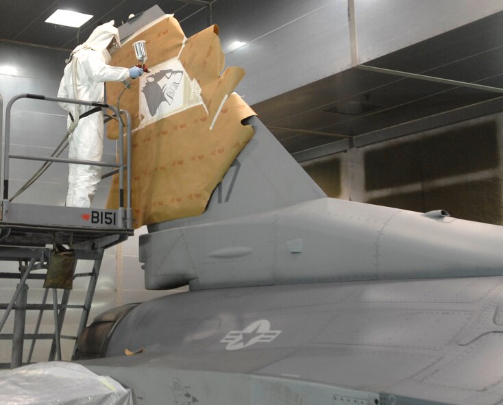 Kunsan Air Base, Republic of Korea –  Senior Airman Brian Sheppard, 8th Maintenance Squadron aircraft structural maintenance journeyman, paints the last “WP” emblem onto one of the last F-16 that the base received here April 30. The F-16 was flown from Eielson Air Force Base Alaska. The 8th Maintenance Squadron turned over 24 jets in a two month time period. (U.S. Air Force photo/Senior Airman Dana D. Hill) 