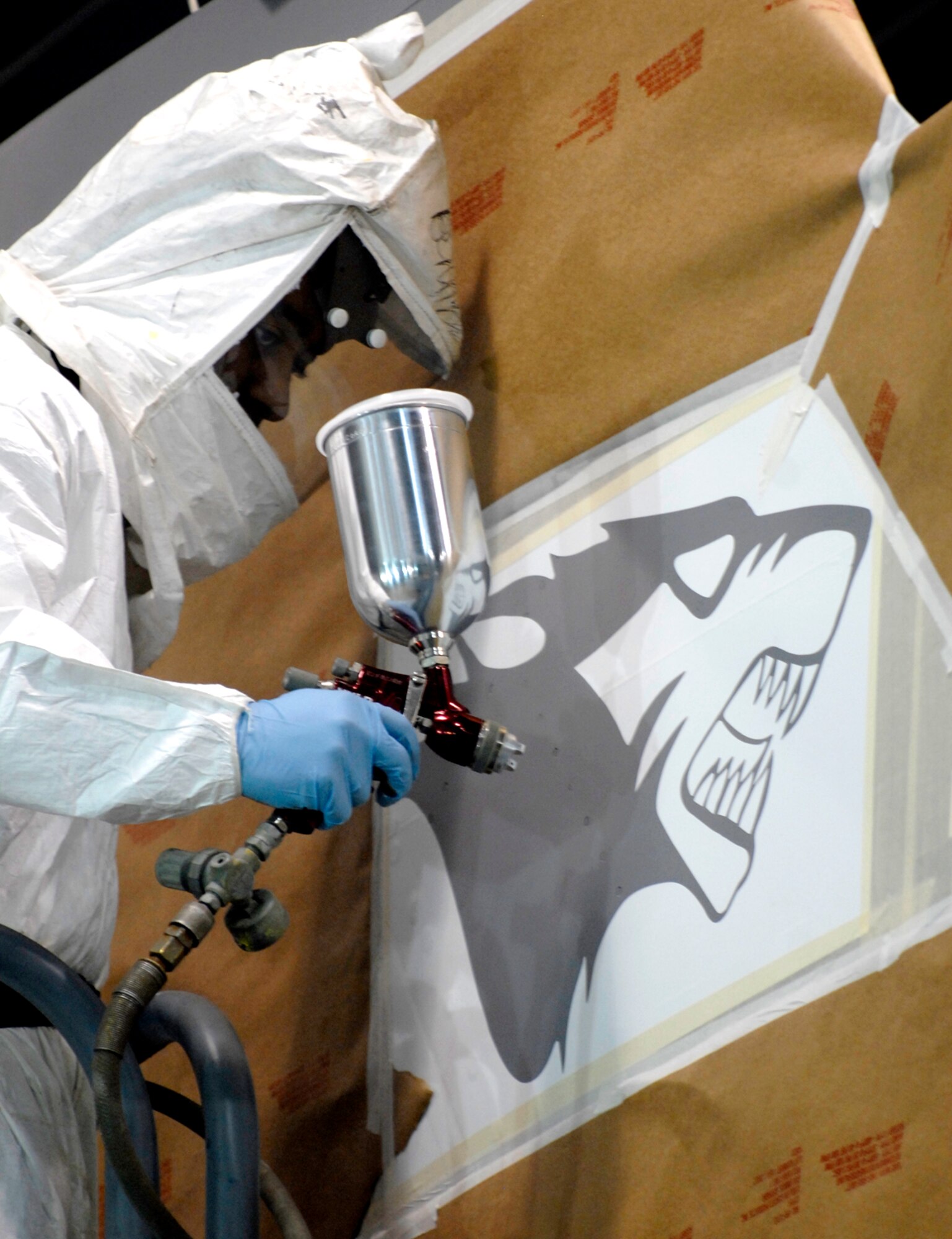 Kunsan Air Base, Republic of Korea –  Senior Airman Brian Sheppard, 8th Maintenance Squadron aircraft structural maintenance journeyman, paints the last “WP” emblem onto one of the last F-16 that the base received here April 30. The F-16 was flown from Eielson Air Force Base Alaska. The 8th Maintenance Squadron turned over 24 jets in a two month time period. (U.S. Air Force photo/Senior Airman Dana D. Hill) 