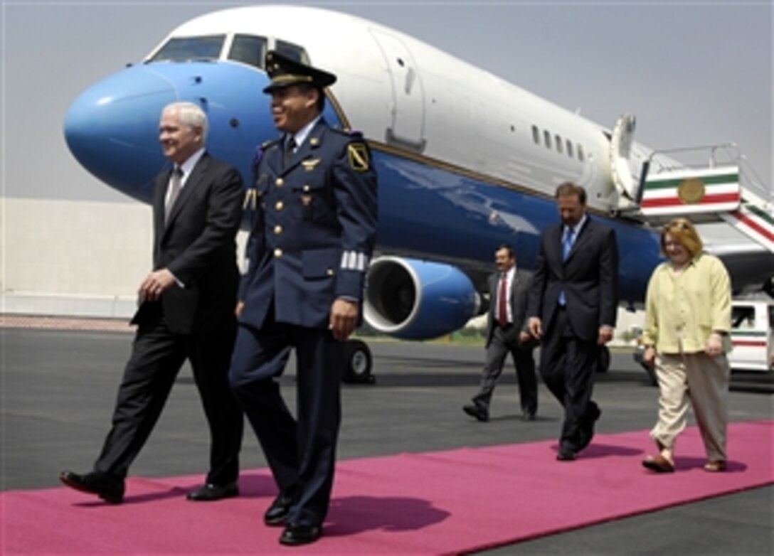 Defense Secretary Robert M. Gates, left, walks with Director of Protocol Lt. Col. Ruben Montesinos as his wife, Becky Gates, walks with Ambassador to Mexico Antonio Garza, upon their arrival in Mexico City, Mexico, April 29, 2008.  