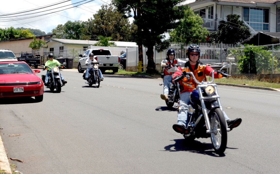 U.S. Marine Corps Forces, Pacific,  riders make their way down Halawa Heights Rd. during the first Ride Safe Club ride August 1 here. Due to increasing numbers of death and motorcycle accidents in the Marine Corps, MARFORPAC has established the new club to promote safety and awareness.