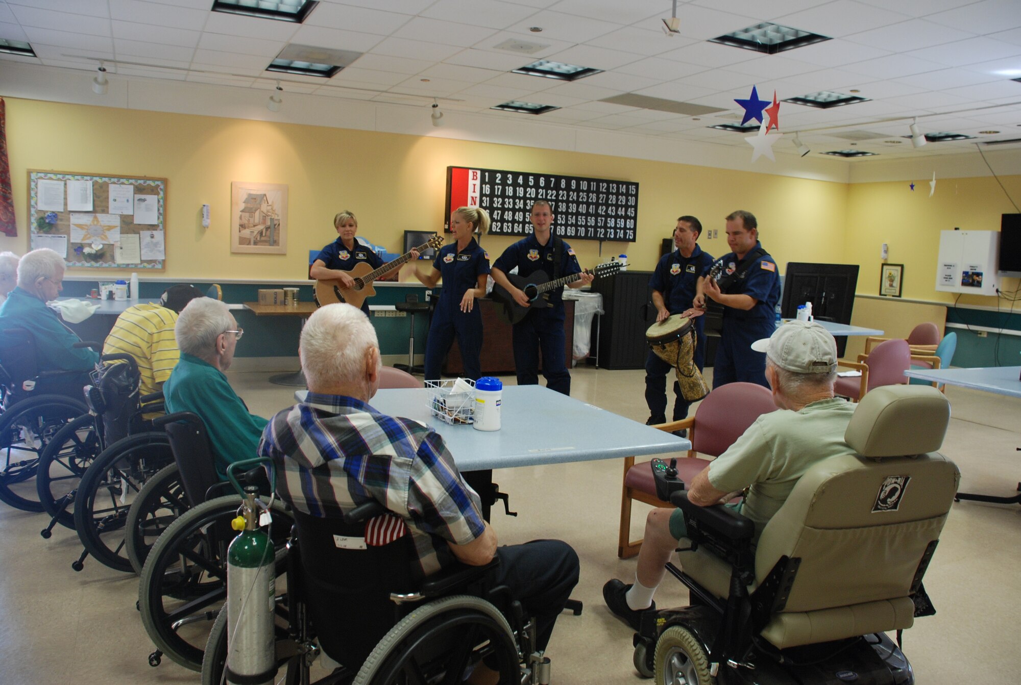 Members of Night Wing, a country music element of the Heartland of America Band, performs popular music for veterans at the Cheyenne Veteran Affairs Medical Center July 24 (Photo by Airman 1st Class Alex Martinez).