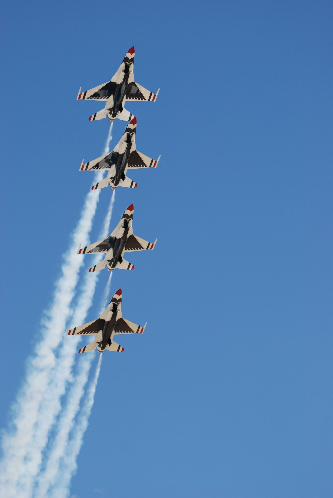 Four Thunderbirds prepare to form a diamond formation, one of their signature stunts, during the air show (Photo by Airman 1st Class Daryl Knee).