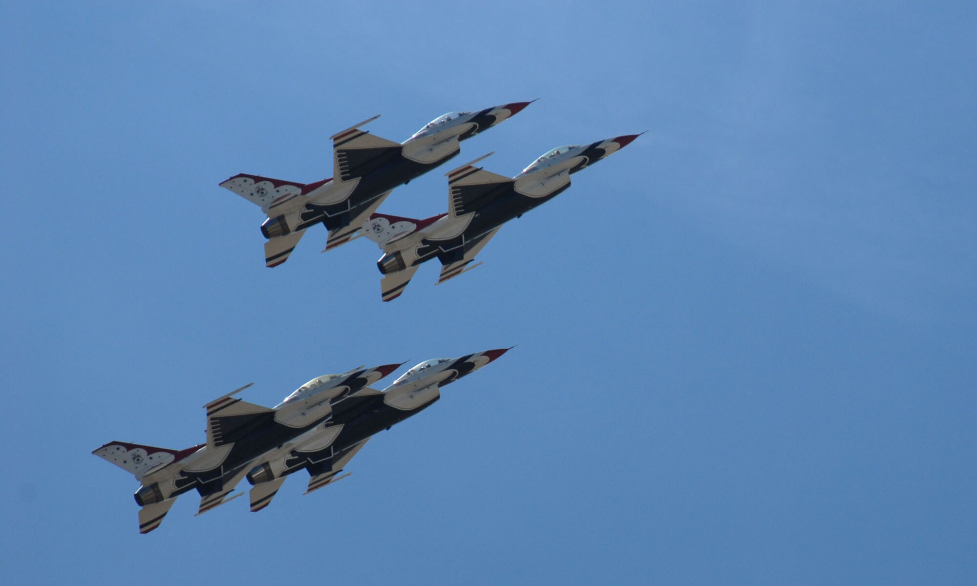 Four Air Force Thunderbirds perform close-range acrobatics above Laramie County Community College July 23. Thousands of people attended the annual air show that is one of the many Cheyenne Frontier Days attractions (Photo by Shelley Raffl).