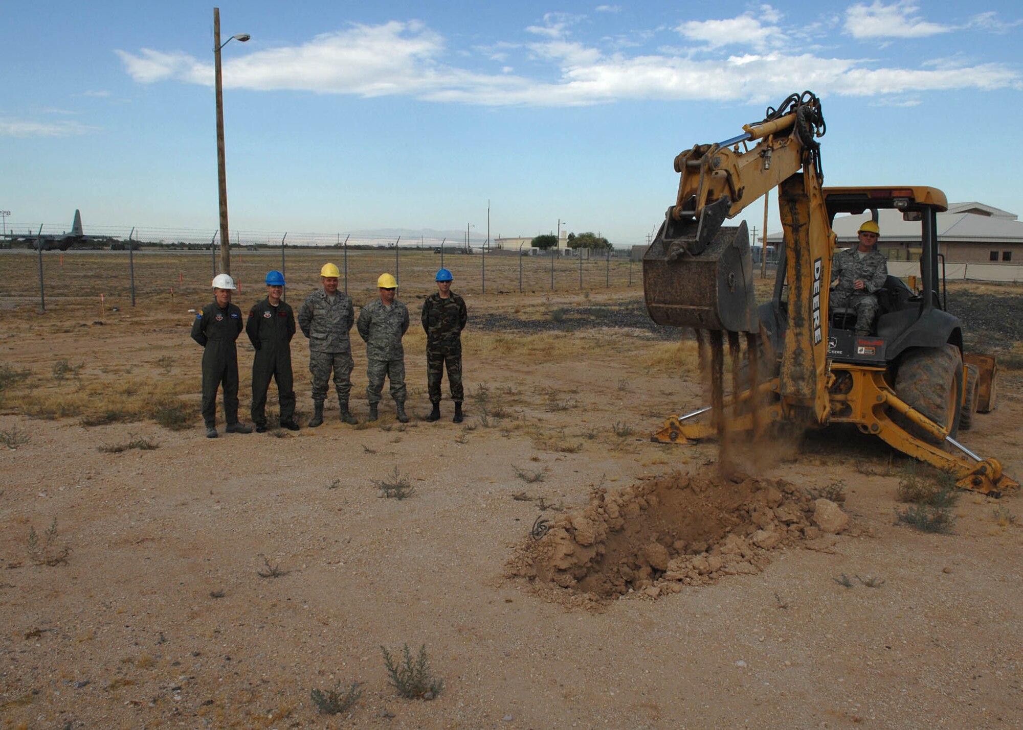 (Left to Right) Col. Kent Laughbaum, 355th Fighter Wing commander, Col. Mark Haskins, 55th Electronic Combat Group commander, Lt.Col. David Carlson, 755th Aircraft Maintenance Squadron commander, Capt. Robert Lewin,  Tech. Sgt. Christopher Russell,  Chief Master Sgt. David Metz, 755th Aircraft Maintenance Squadron breaks grounds on what will be the new COMPASS CALL Hanger located between the 41st Electronic Combat Squadron and the 43rd Electronic Combat Squadron.  The 55th Electronic Combat Group will be able to use the hangar to get the planes and people out of the heat.  (US Air Force Photo By: Senior Airman Jacqueline Romero)