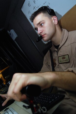 JOINT BASE BALAD, Iraq -- Airman 1st Class Jesse Morse operates the onboard sensor of an MQ-1 Predator unmanned aerial system as it prepares to take off from here Aug. 1. Airmen at Creech Air Force Base, Nev., control Predators during much of their missions, but pilots and sensor operators here operate the aircraft during takeoff and landing. Airman Morse, a Predator sensor operator with the 46th Expeditionary Reconnaissance and Attack Squadron here, is deployed from Creech AFB. (U.S. Air Force photo/Staff Sgt. Don Branum)