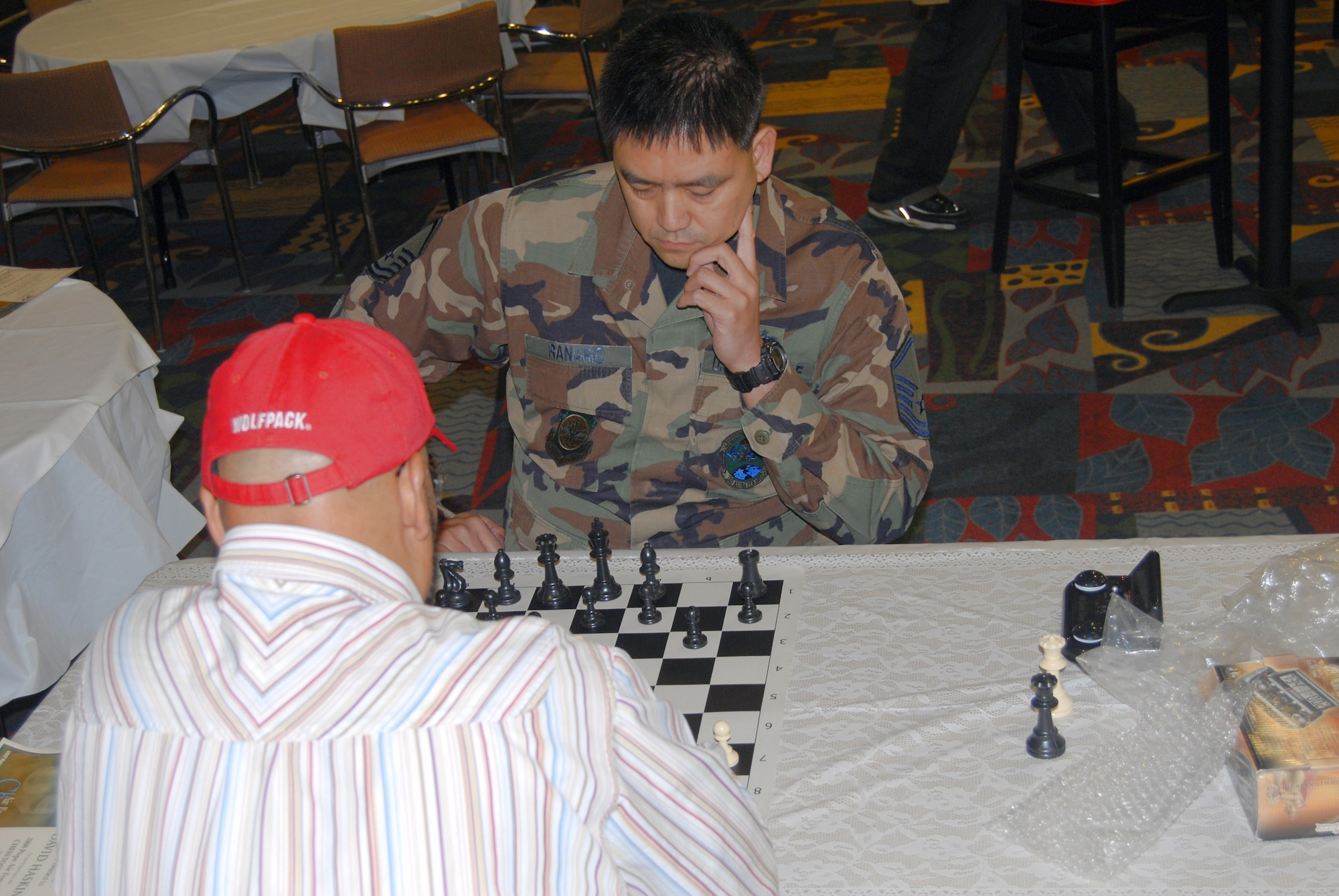 Master Sgt. Dan Ranario contemplates his next move during a chess tournament in the community activities center at Pope Air Force Base, N.C. Sergeant Ranario will compete as a member of the U.S. chess team in the 19th North Atlantic Treaty Organization Chess Championship Aug. 4 through 8 in Brussels, Belgium. Sergeant Ranario is assigned to the 3rd Aerial Port Squadron. (U.S. Air Force photo/Airman 1st Class Mindy Bloem) 
