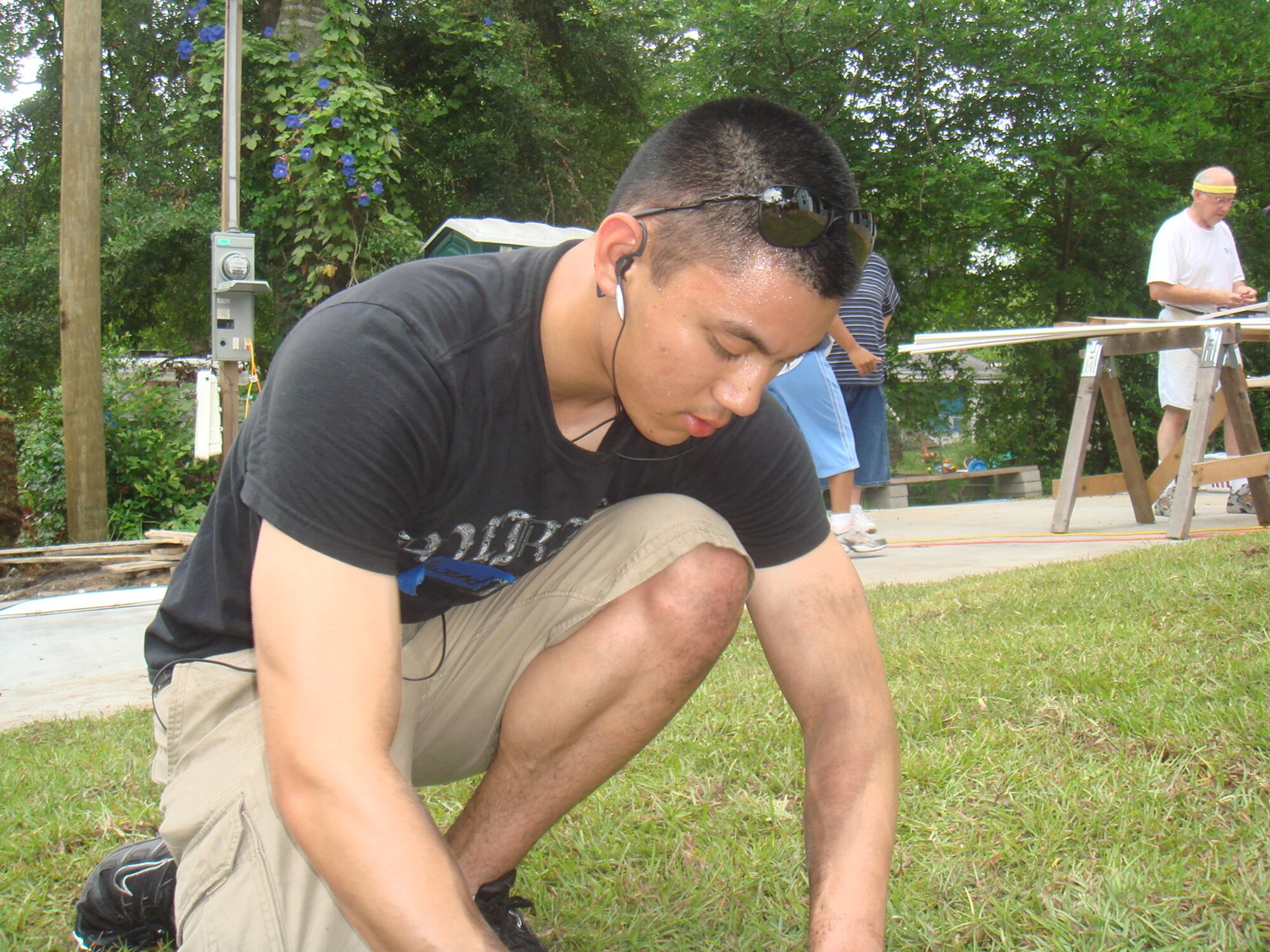 Cadet First Class Edward Tison, U.S. Air Force Academy cadet, helps landscape a new residence built by local "Habitat for Humanity" volunteers. Cadet Tison and seven other Air Force Academy cadets visited Tyndall for two-weeks in July as part of the "Operations Air Force Program," which allows cadets to shadow officers and enlisted members at installations throughout the Air Force. During their stay at Tyndall, the cadets shadowed officers, toured the installation and participated in community relations events.