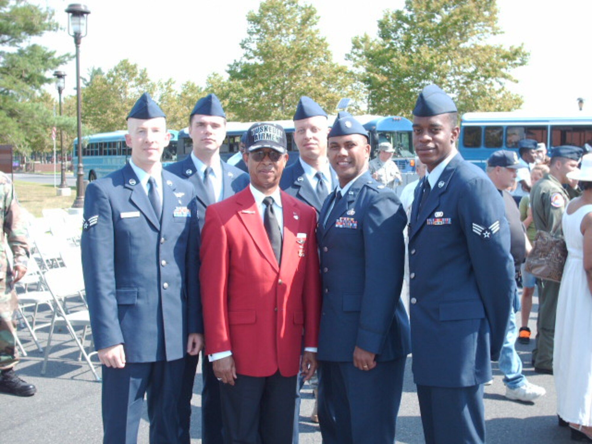 (From left to right) Senior Airman Jason McEachern, 43rd Aeromedical Evacuation Squadron, Staff Sgt. Kenneth Key, 43rd Medical Support Squadron, Master Sgt. Terrence Spradley, 43rd Aircraft Maintenance Squadron, Lt. Col. Lionel Earl, 43rd Airlift Wing, and Senior Airman Dwayne Franklin Jr., 43rd Communications Squadron, pose with Lt. Gen. (Ret) Russell Davis, one of the original Tuskegee Airmen. The five Pope members attended the 37th Annual Tuskegee AIrmen Convention in Pennsyvania July 17 through 19. (Courtesy Photo)