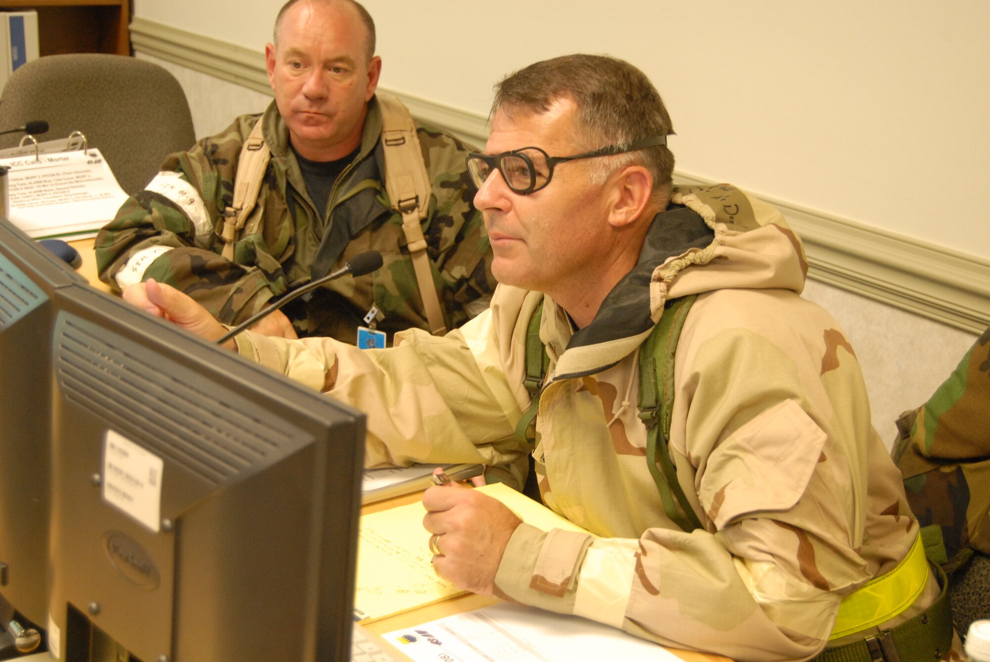 Col. John McDonald, 43rd Airlift Wing Commander, briefs the Installation Control Center and Emergency Operations Center during the Mobility Exercise 08-04 in Bldg. 900 Wednesday. The EOC was activated for 24-hour operations Wednesday through today. (U.S. Air Force Photo by Staff Sgt. Jon LaDue)