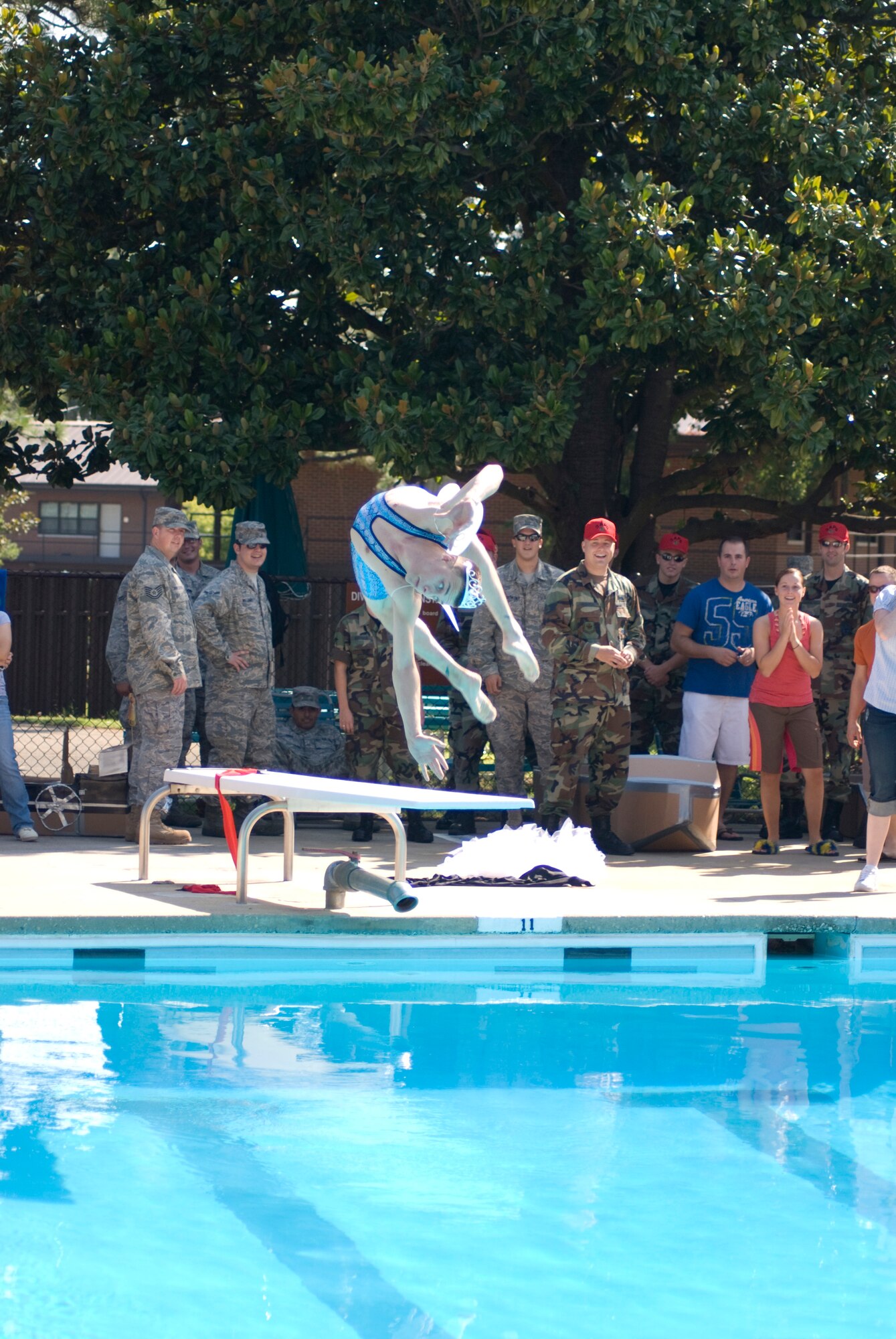 Airman 1st Class Miguel Mota, 43rd Logistics Readiness Squadron, does a dive at the Pope pool during the 2008 Pope Regatta goofy dive contest July 24. (U.S. Air Force Photo by Tech. Sgt. Steven Kennedy)