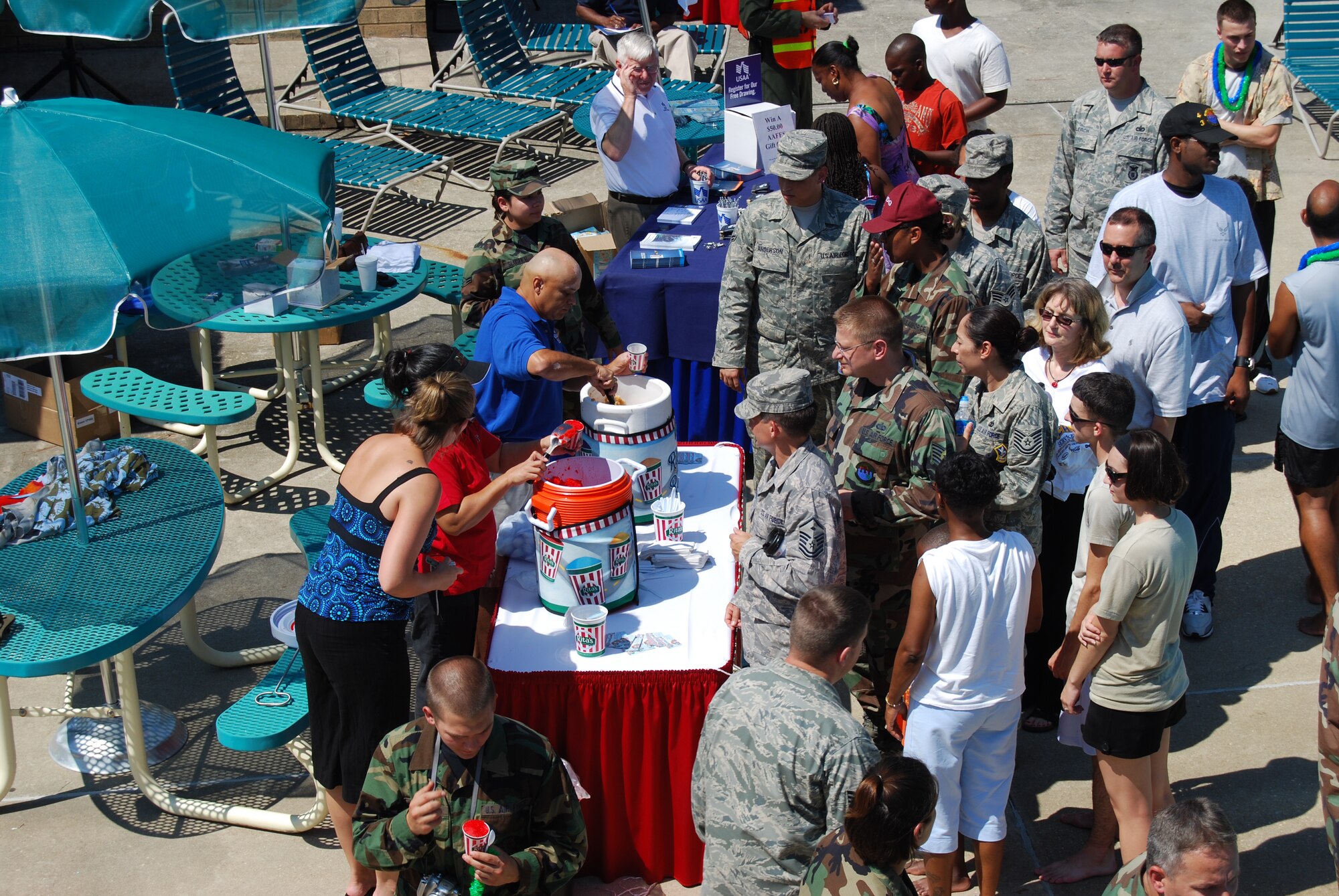 Contestants and spectators wait in line for a complimentary Rita slushy during the 2008 Pope Regatta at the Pope pool July 24. (U.S. Air Force Photo by Staff Sgt. Brian Margavich)