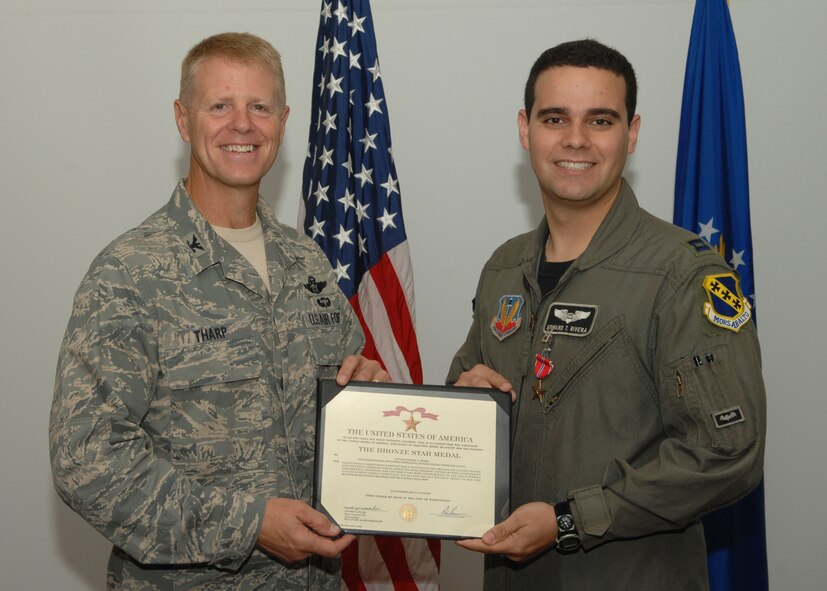 DYESS AIR FORCE BASE, Texas – Capt. Edward Rivera is presented with the Bronze Star Medal by Col. Donald Tharp, 3rd Air Support Operations Group commander, July 31. He received the BSM for his deployed service as air liaison officer for Army battalions while deployed to Iraq Nov. 23, 2006, to June 1, 2007. (U.S. Air Force photo by Senior Airman Jennifer Romig)