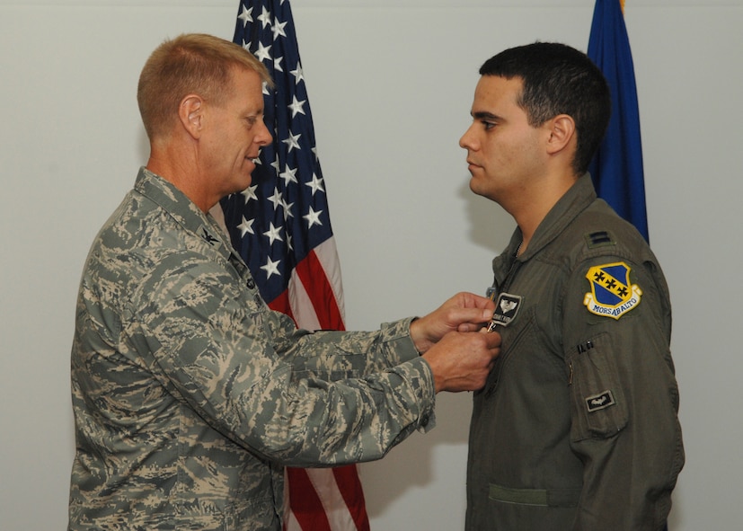 DYESS AIR FORCE BASE, Texas – Capt. Edward Rivera is presented with the Bronze Star Medal by Col. Donald Tharp, 3rd Air Support Operations Group commander, July 31. He received the BSM for his deployed service as air liaison officer for Army battalions while deployed to Iraq Nov. 23, 2006, to June 1, 2007. (U.S. Air Force photo by Senior Airman Jennifer Romig)