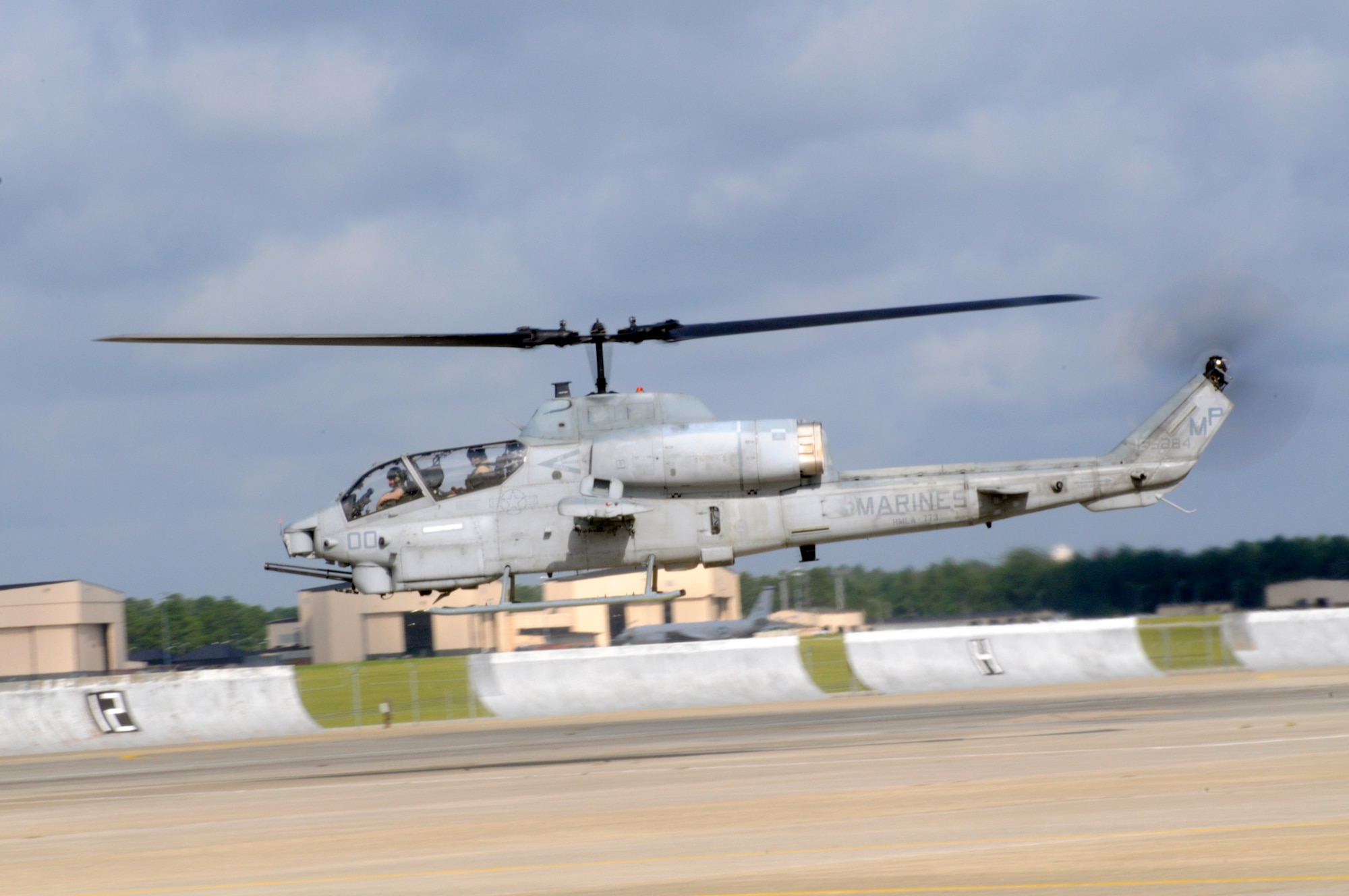 An AH-1 Cobra lifts off from Robins after the groundbreaking here July 30 for the new Marine Light/Attack Helicopter squadron 773 hanger. U. S. Air Force photo by Sue Sapp